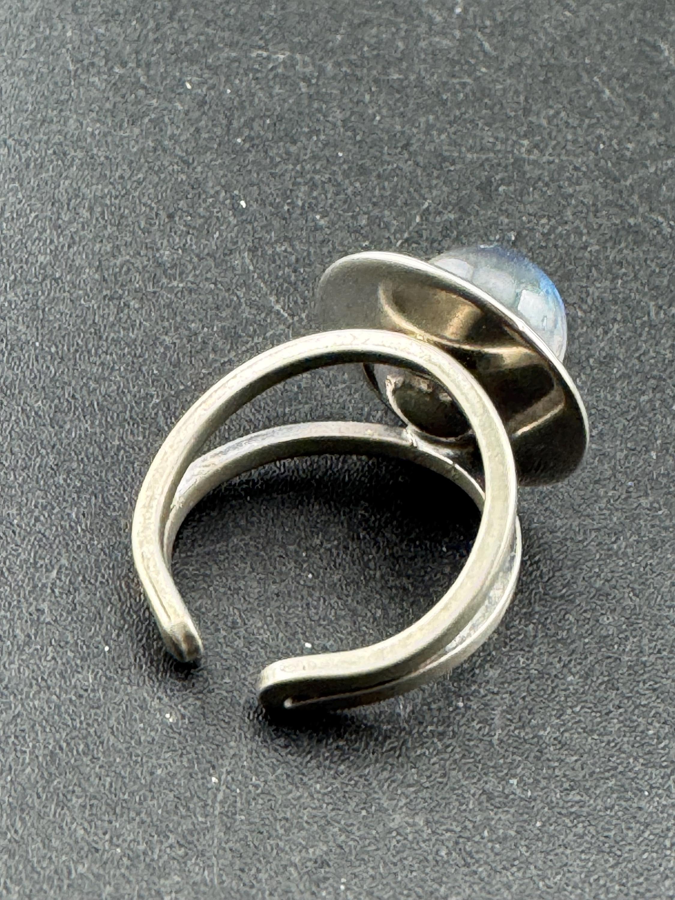 1970s stainless steel adjustable ring, set with blue glass ball cabochon