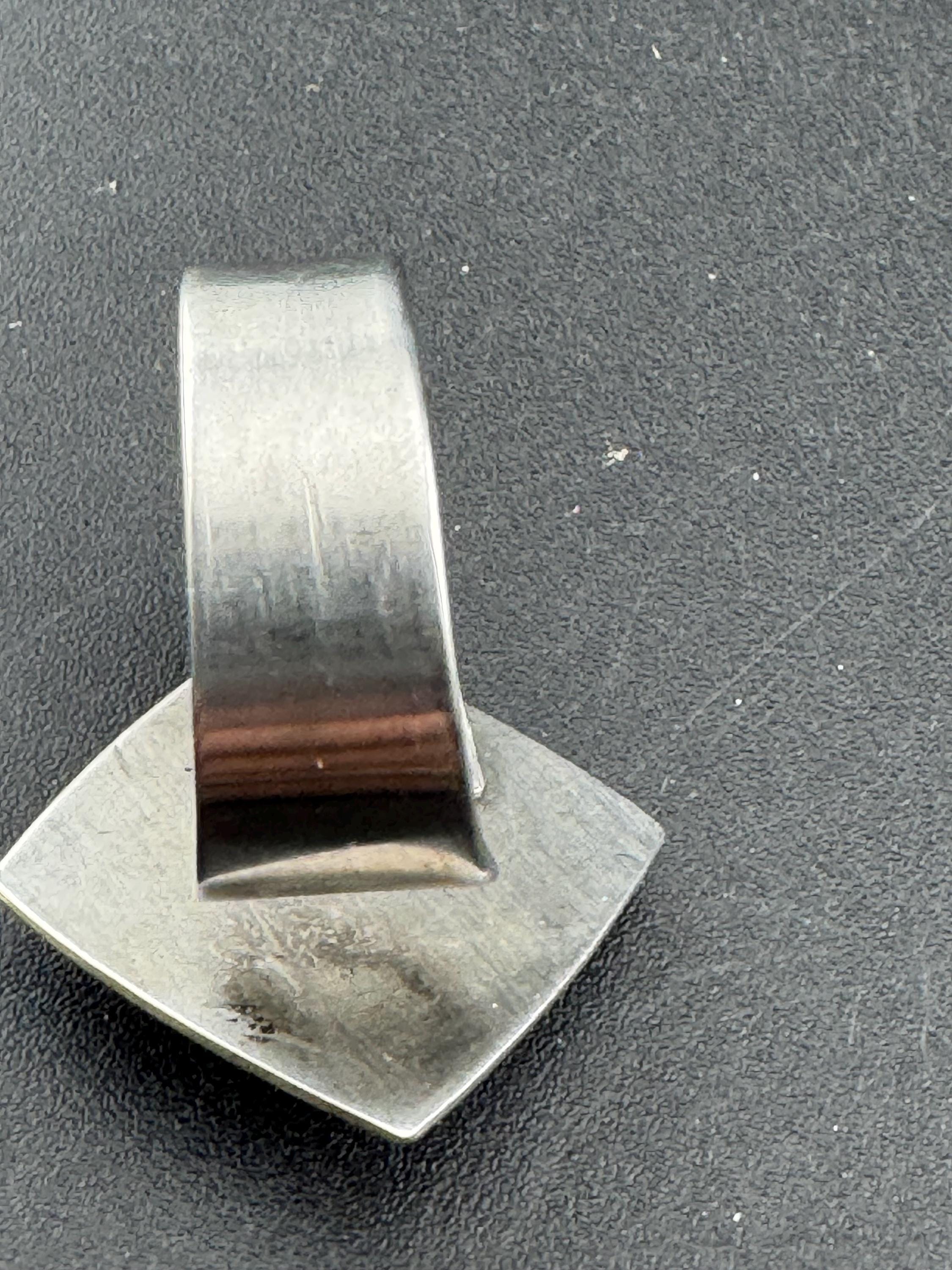 1970s stainless steel adjustable ring, with carved shell cameo