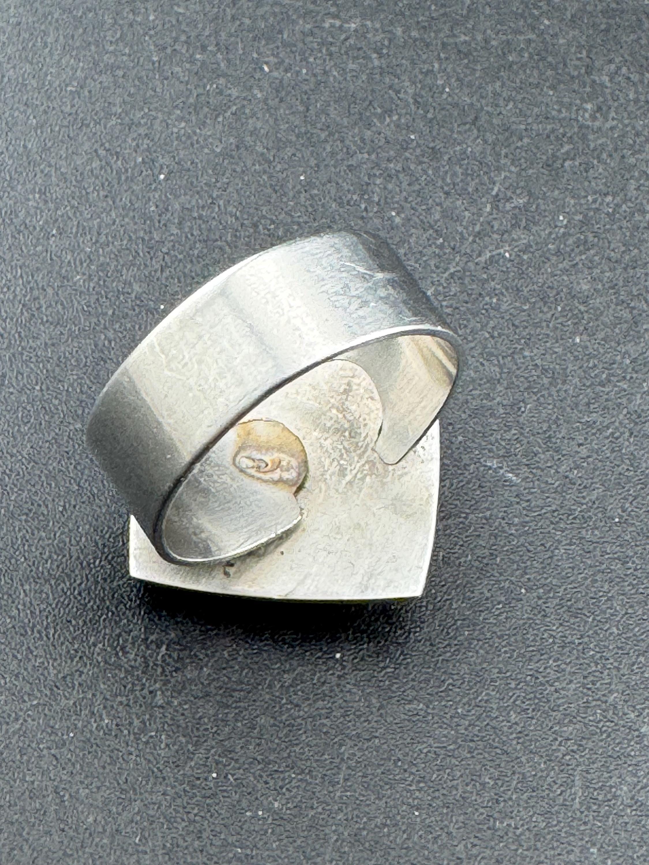 1970s stainless steel adjustable ring, with carved shell cameo