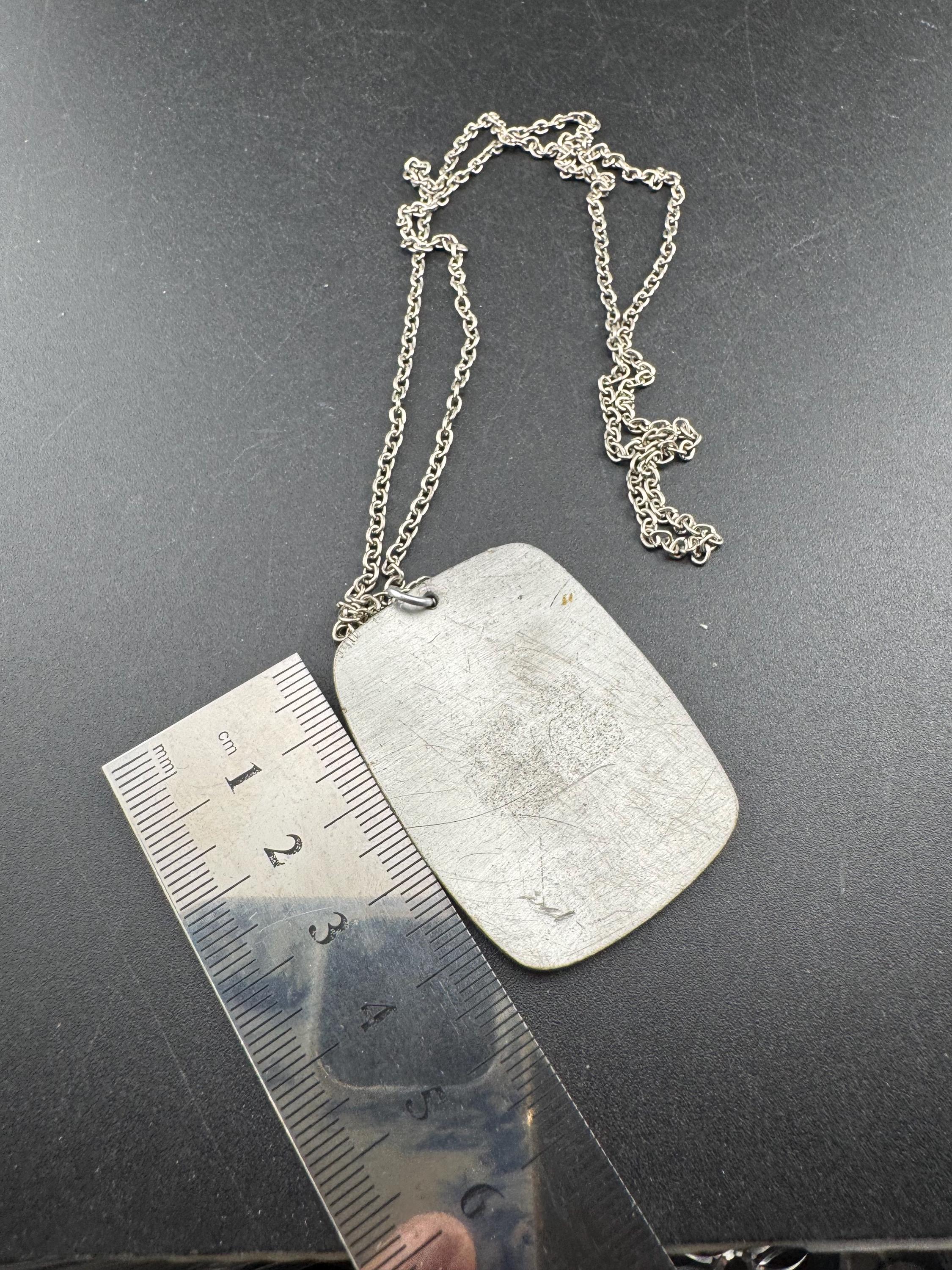 Vintage 1970s stainless steel etched pendant on a 68cm chain