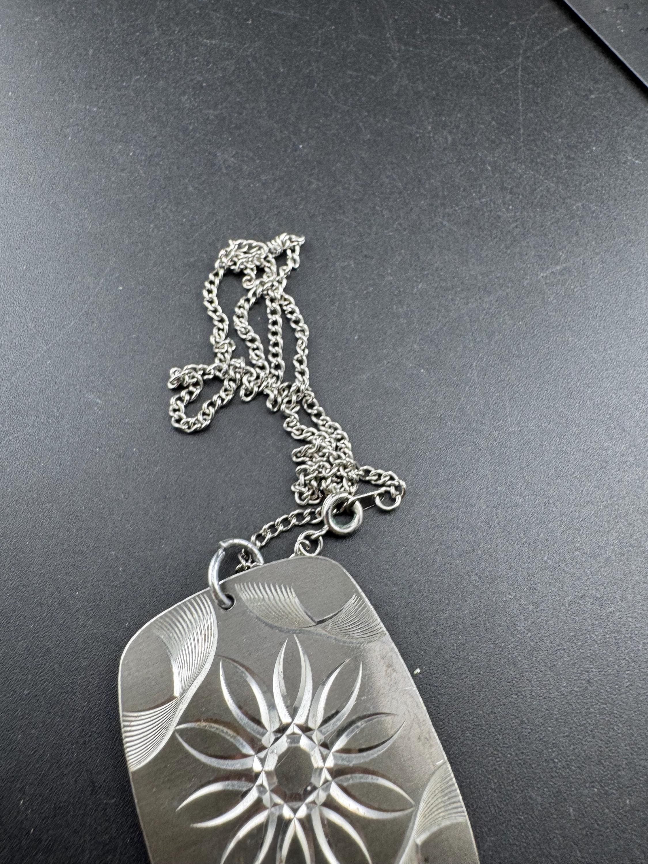 Vintage 1970s stainless steel etched pendant on a 41cm chain