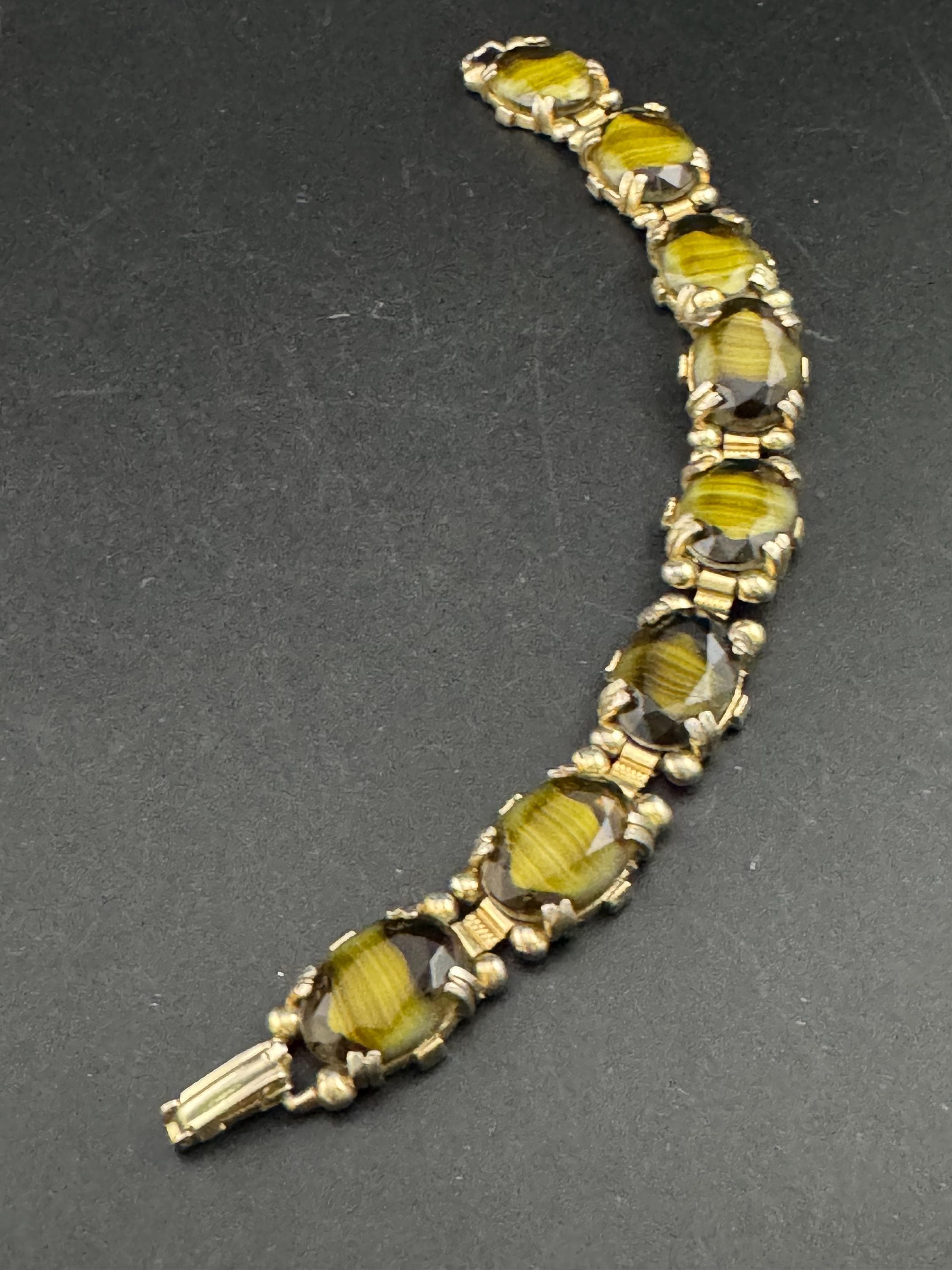 Vintage dark olive green Gold Tone panel link cocktail bracelet, givre glass marbled cabochons