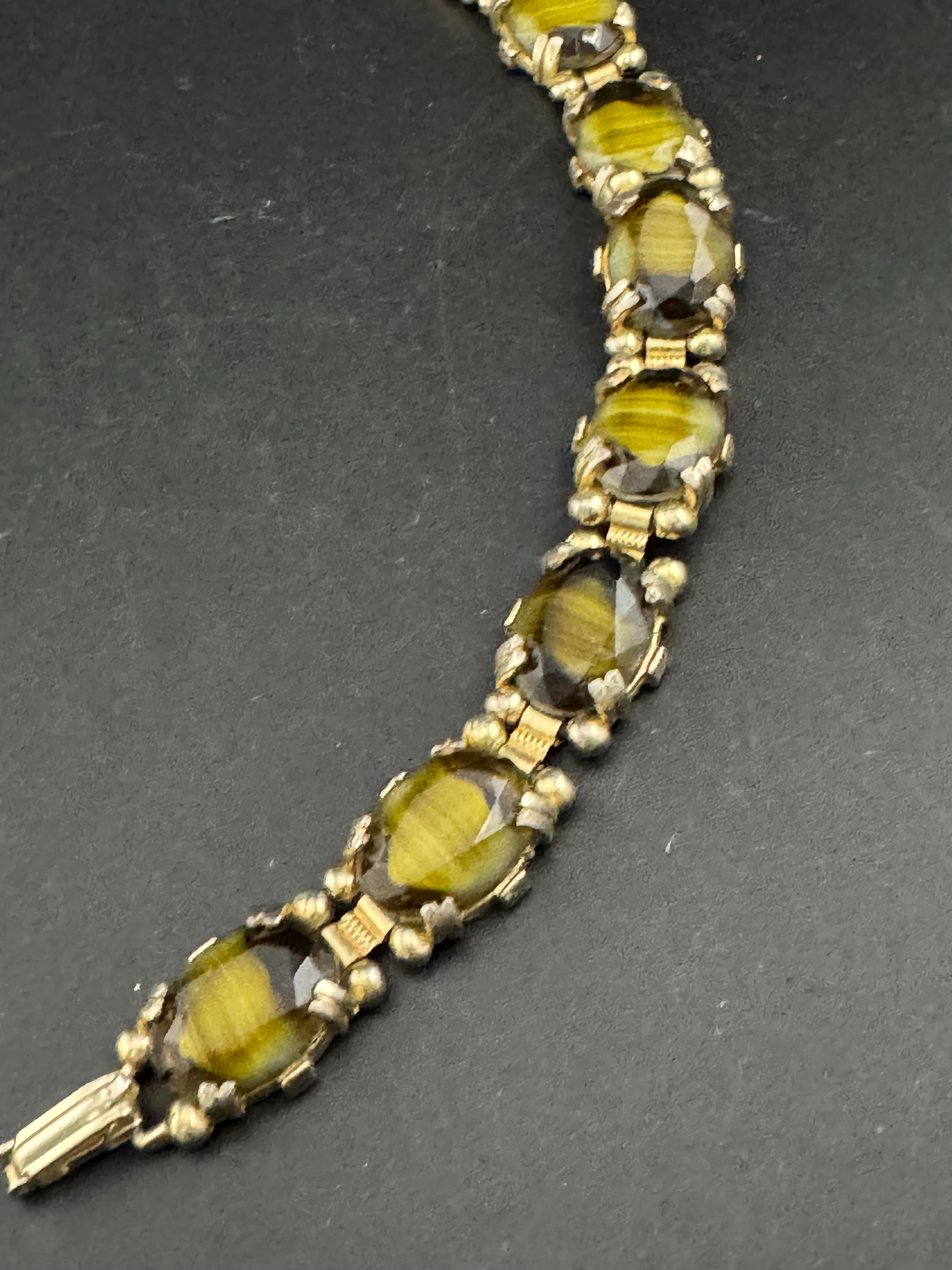 Vintage dark olive green Gold Tone panel link cocktail bracelet, givre glass marbled cabochons