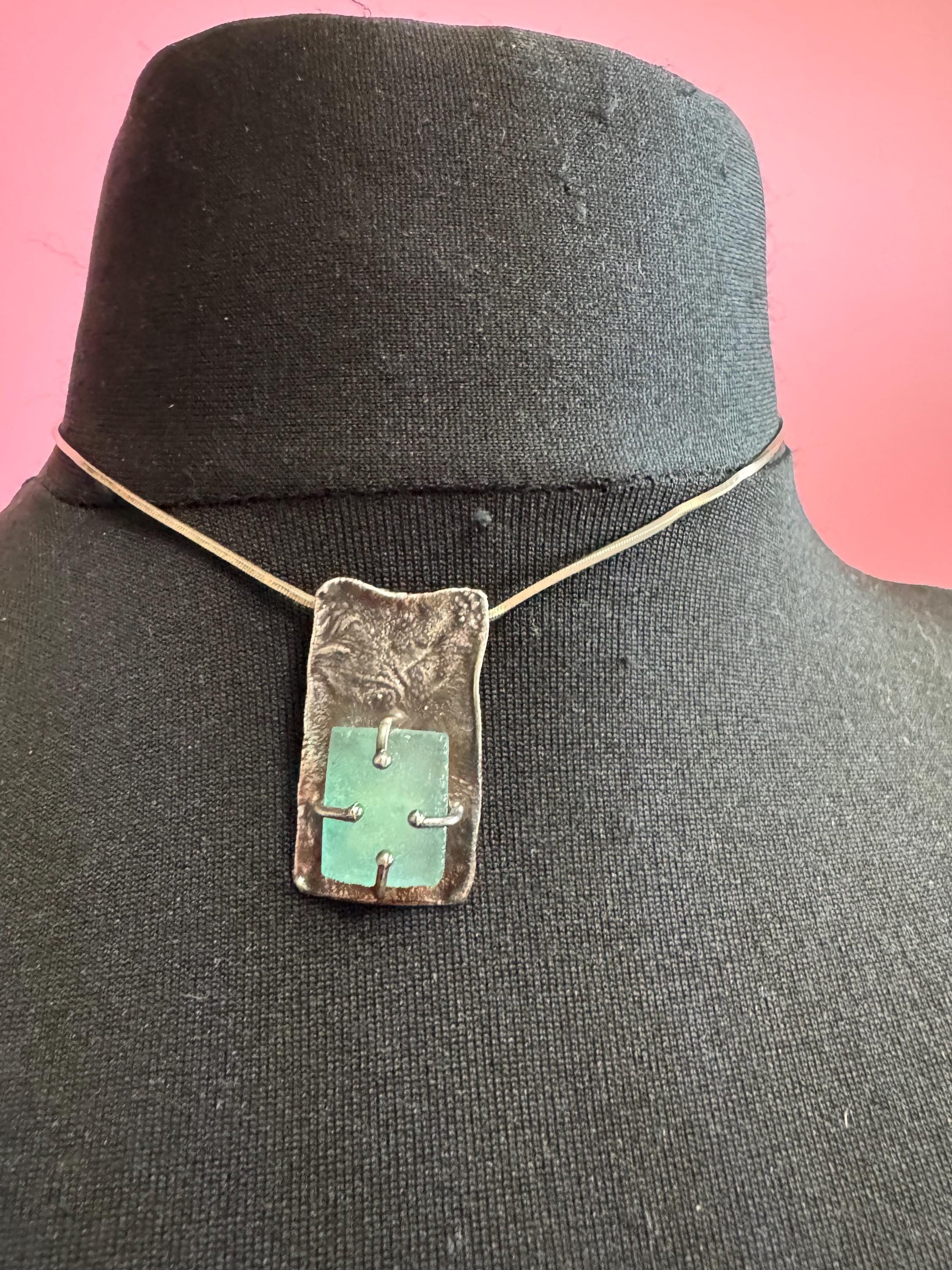 925 silver blue roman glass pendant by the artisan Luli Hamersztein.