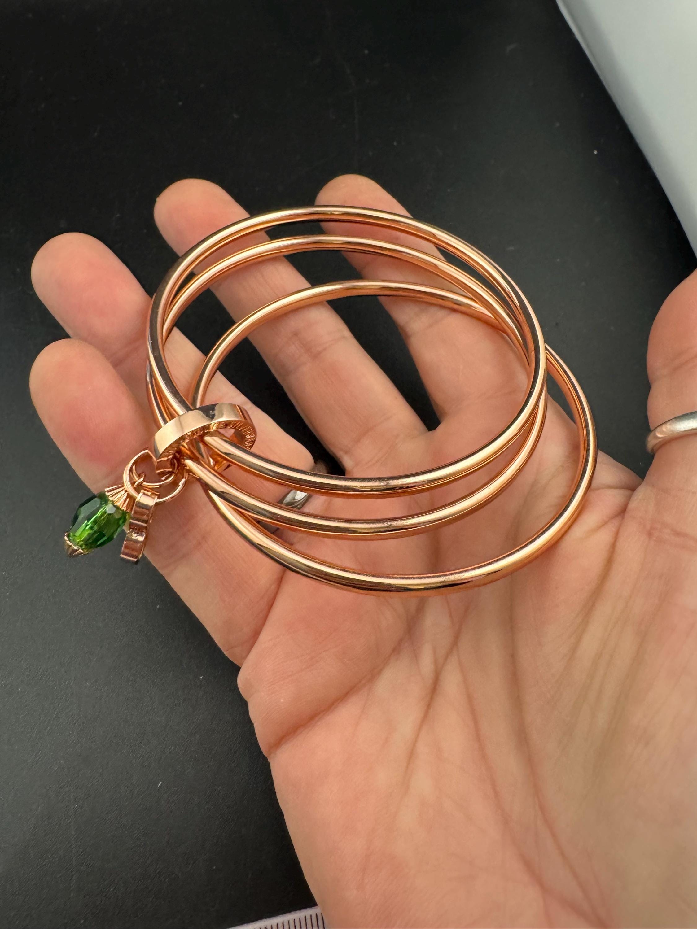 NEWBRIDGE triple rose gold plated birthstone bangles, May birthday emerald beads