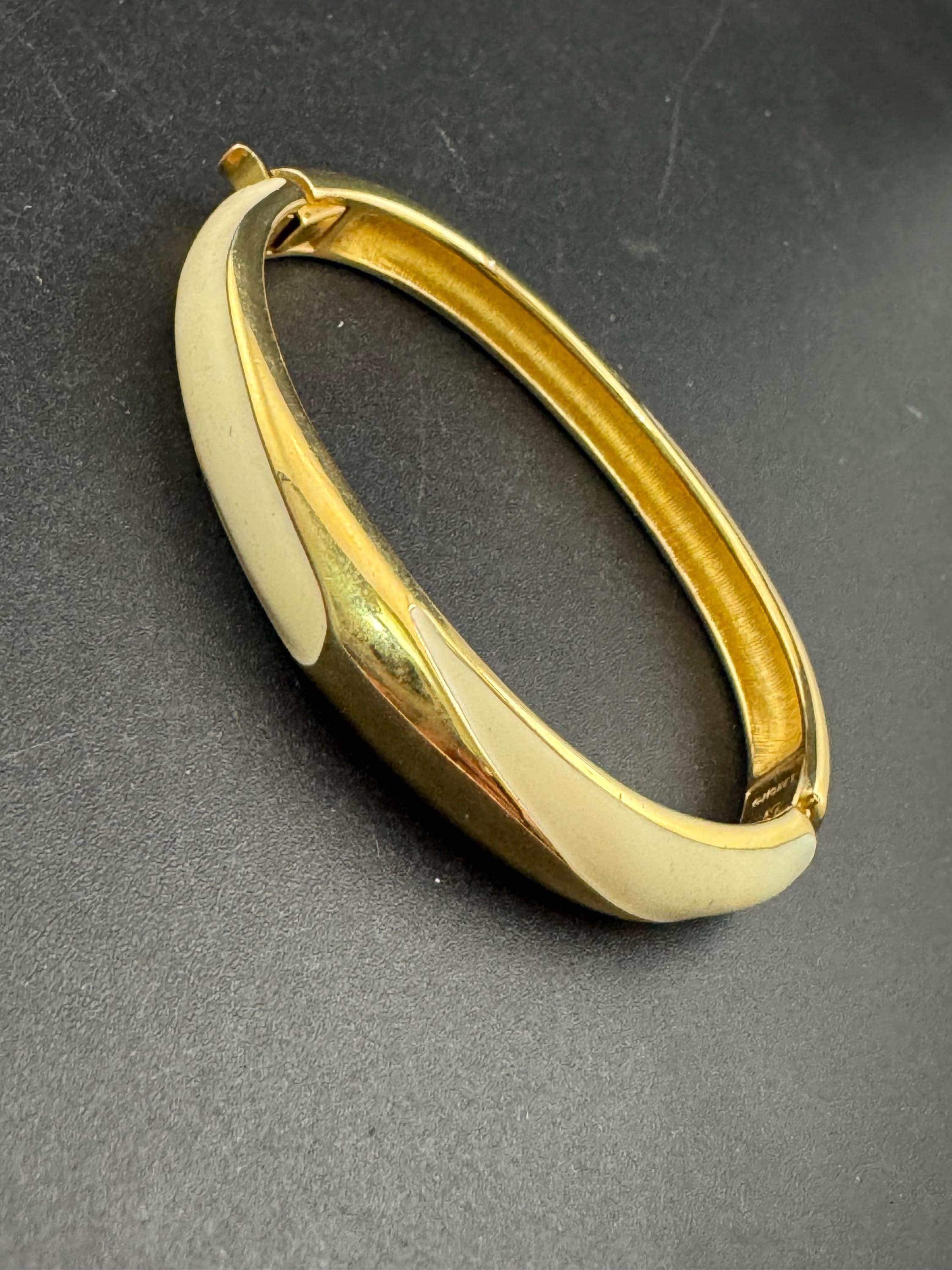 MONET signed cream enamel gold bangle bracelet, hinged clamper