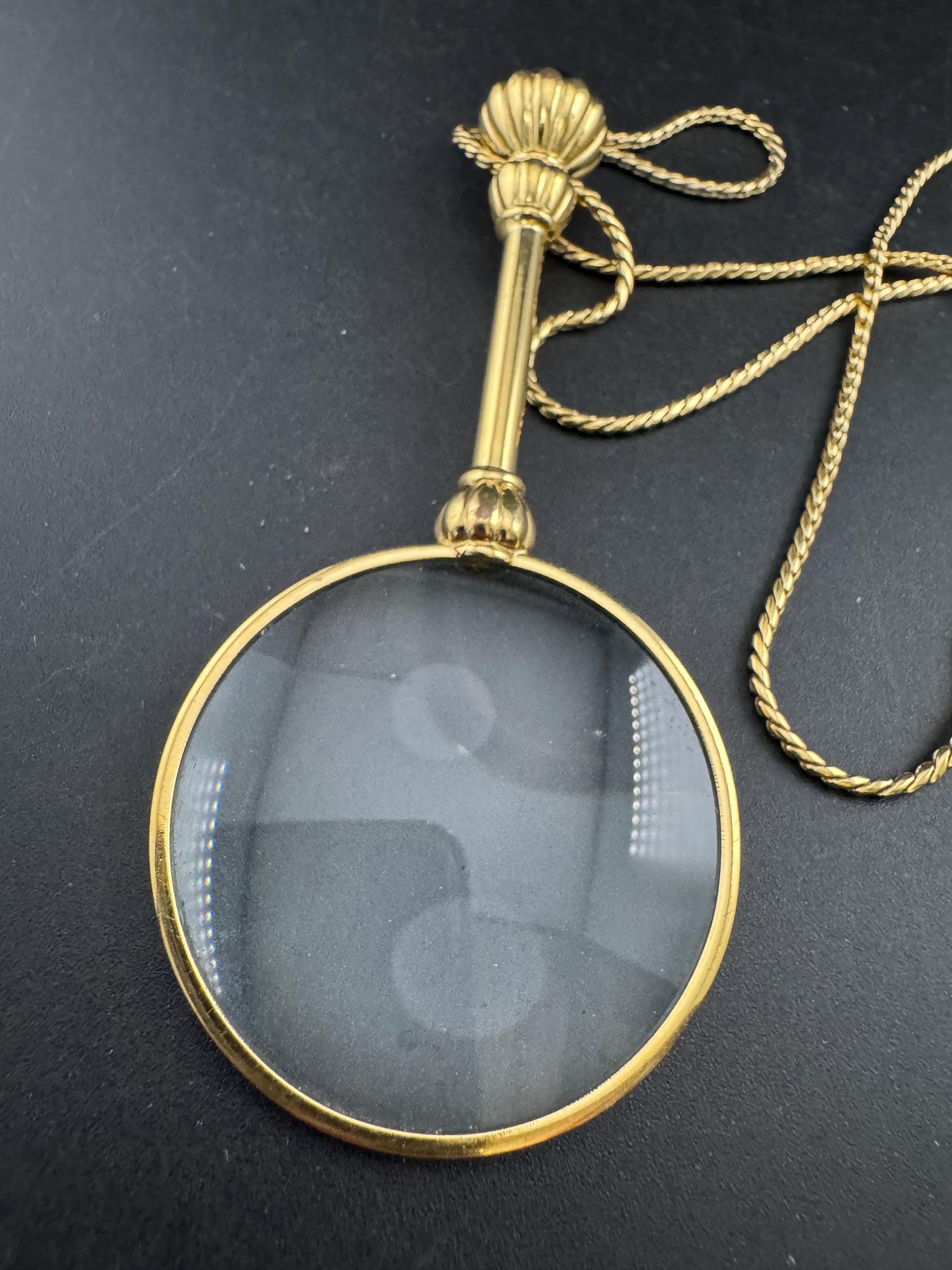 Vintage jewellers loupe eyeglass magnifier pendant necklace, gold plated with blue glass cabochon