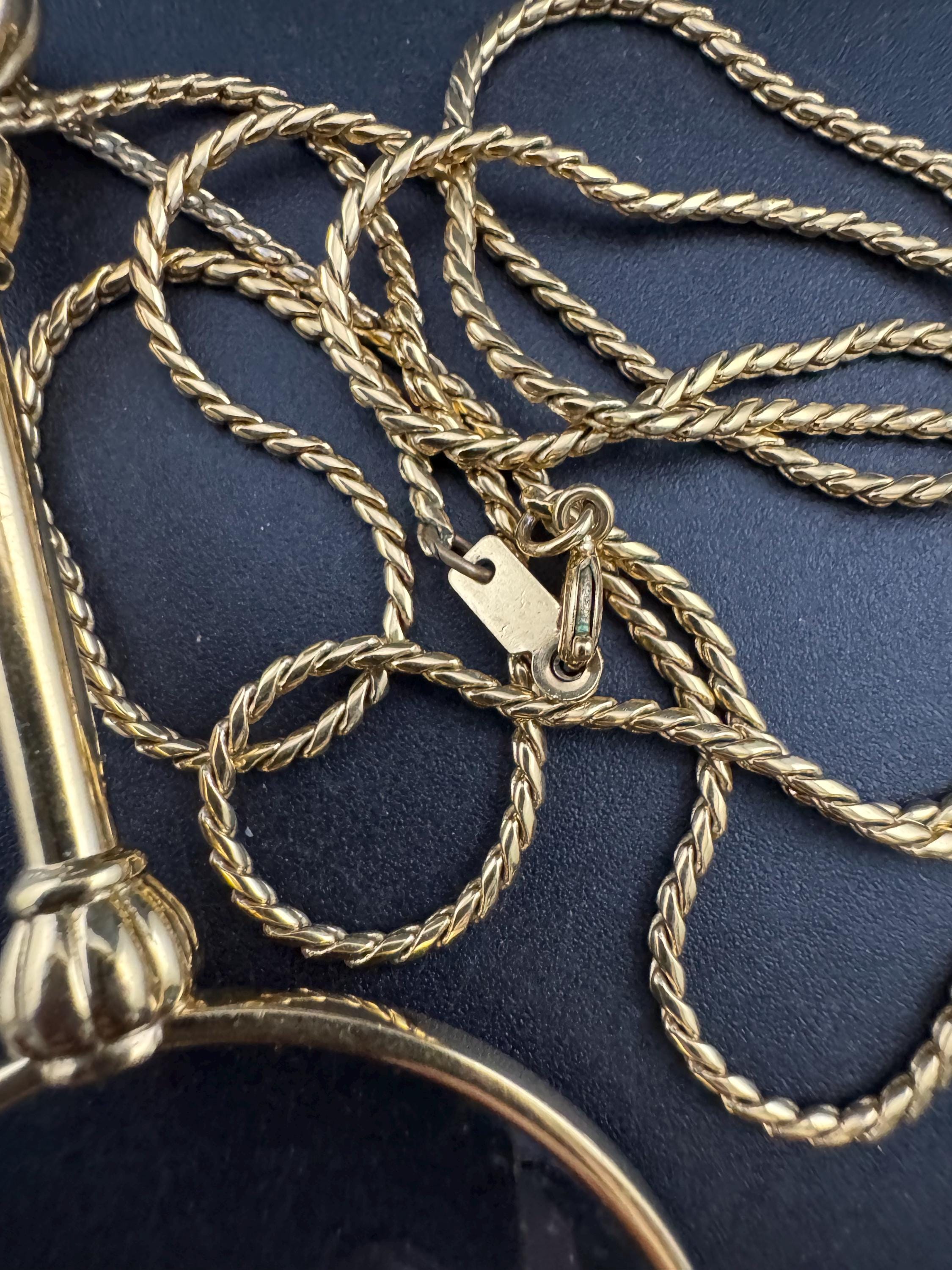 Vintage jewellers loupe eyeglass magnifier pendant necklace, gold plated with blue glass cabochon