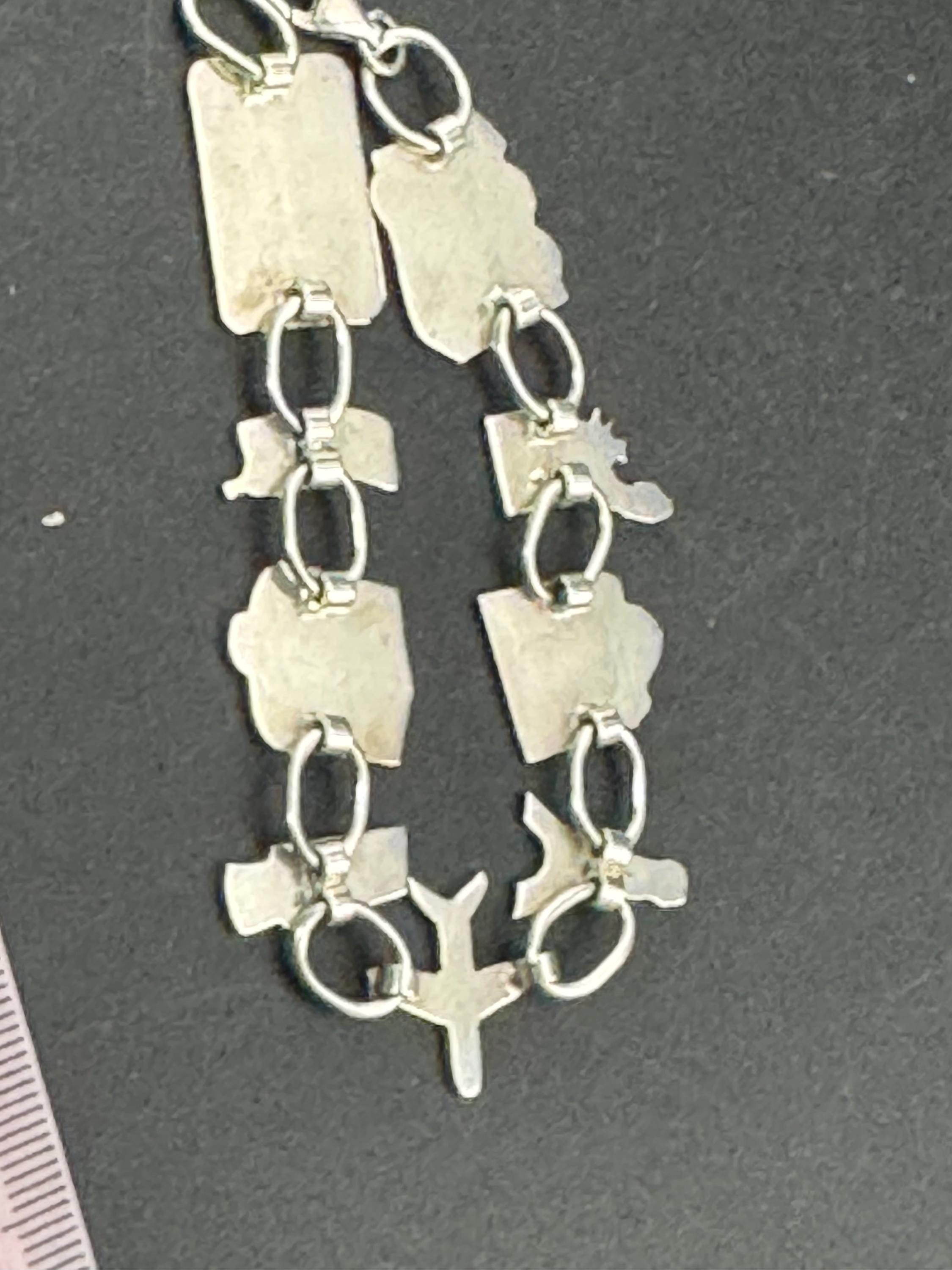 Quirky retro 925 travel themed charm bracelet, panel link in sterling silver