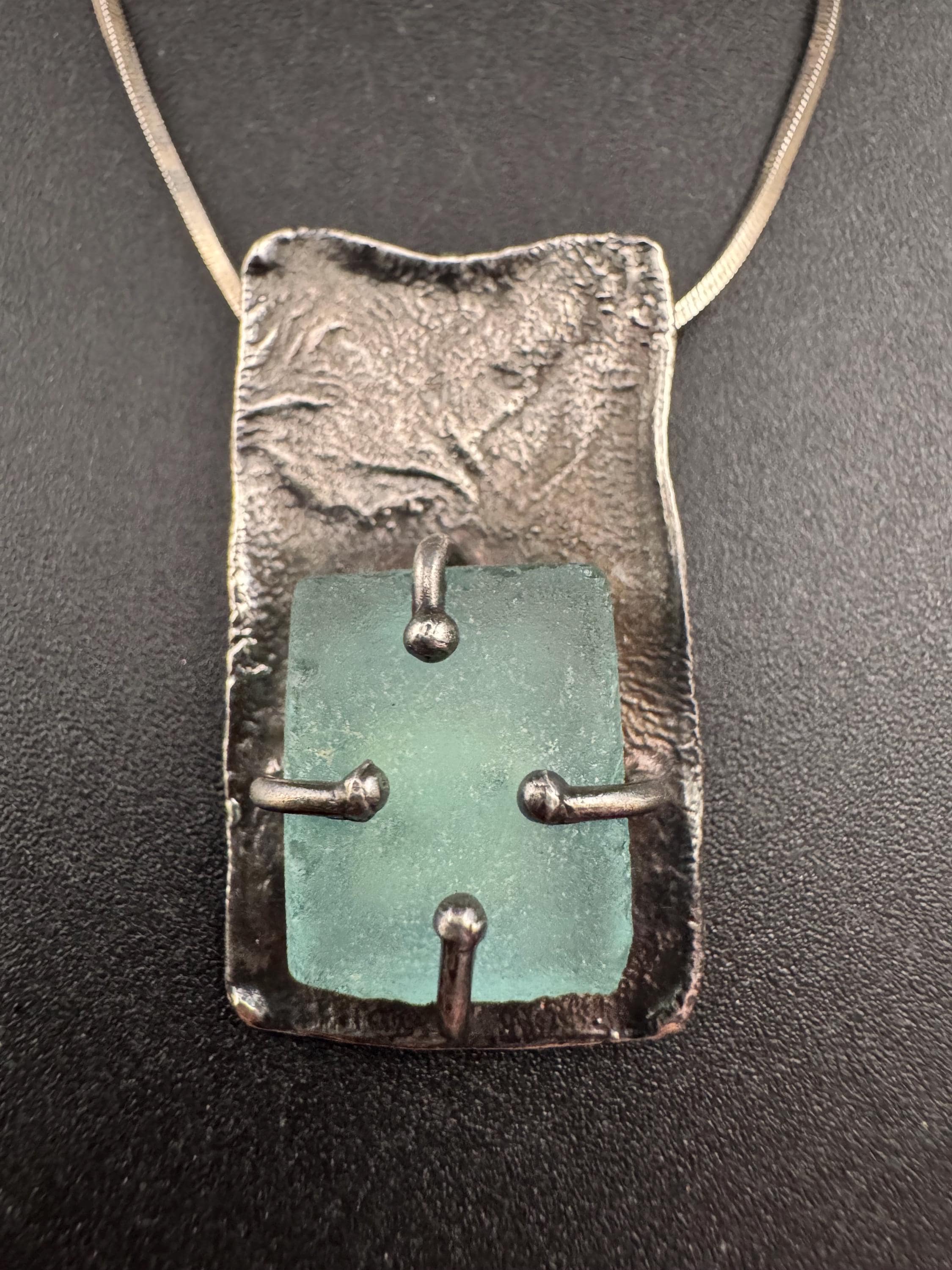 925 silver blue roman glass pendant by the artisan Luli Hamersztein.
