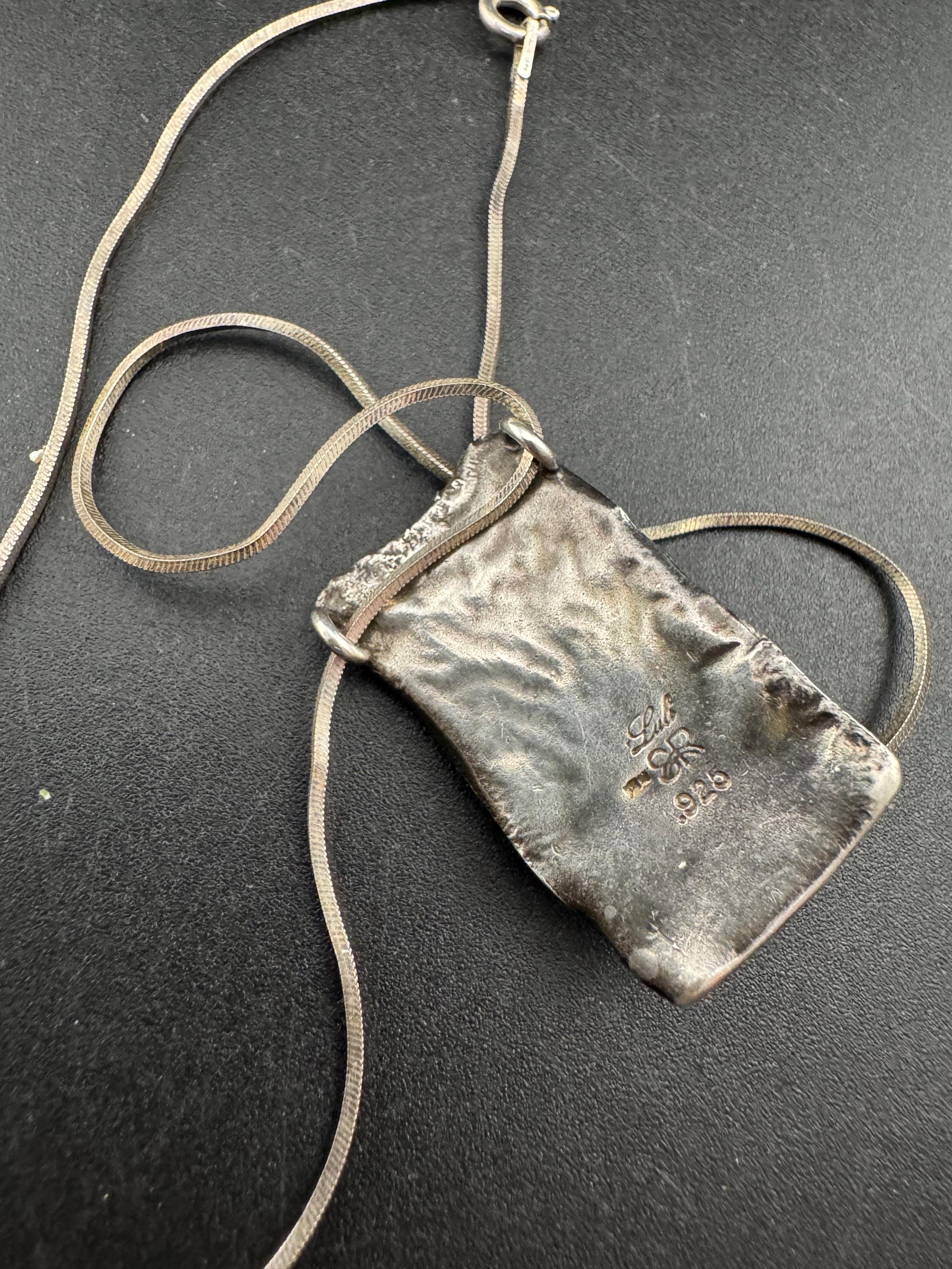 925 silver blue roman glass pendant by the artisan Luli Hamersztein.