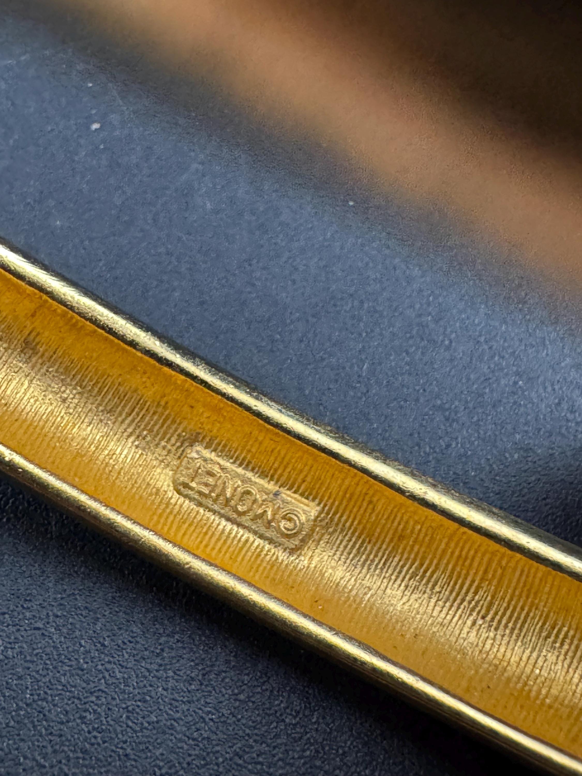 MONET signed cream enamel gold bangle bracelet, hinged clamper