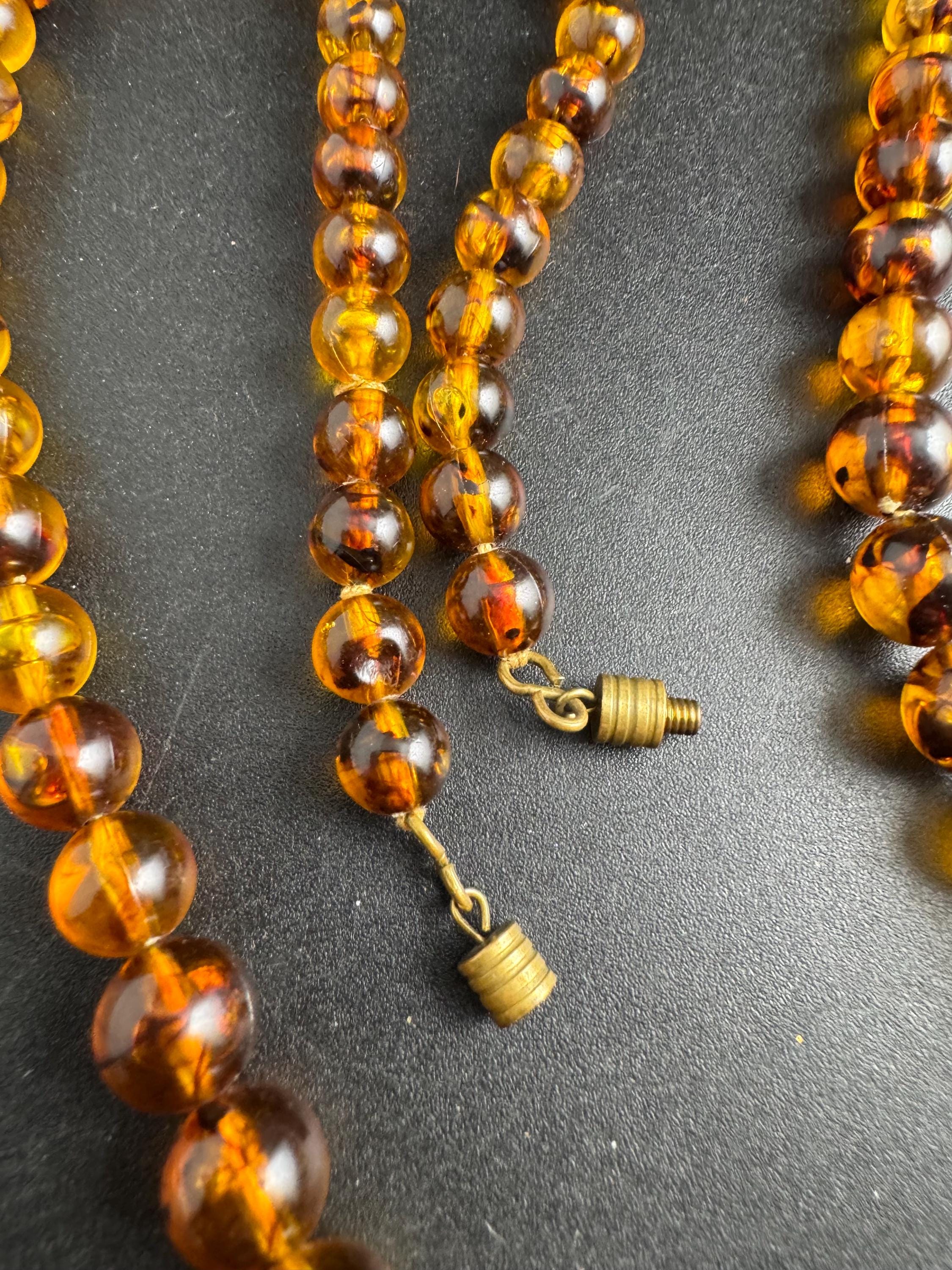 Long Faux Amber orange brown beaded necklace, plastic beads