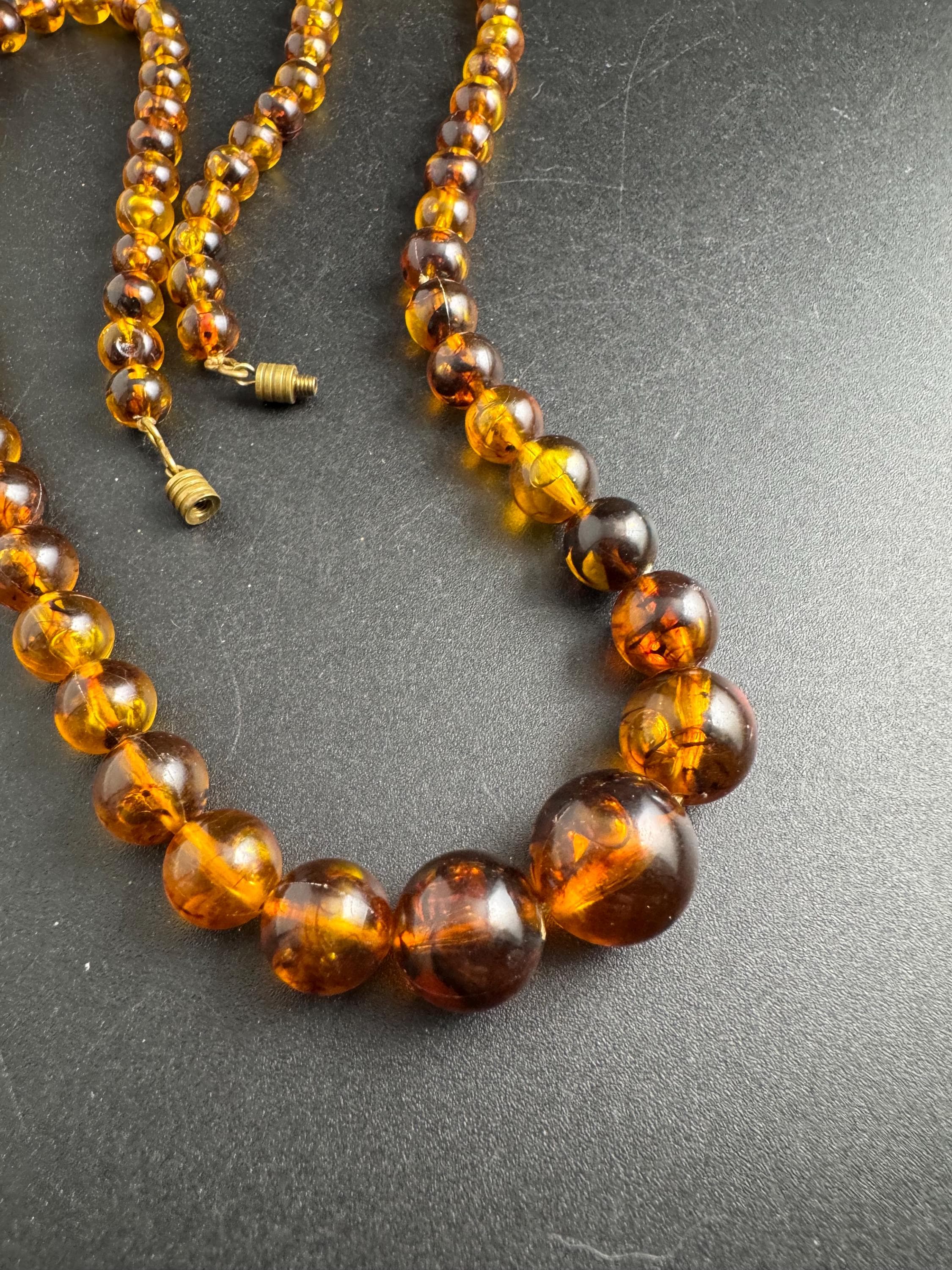 Long Faux Amber orange brown beaded necklace, plastic beads