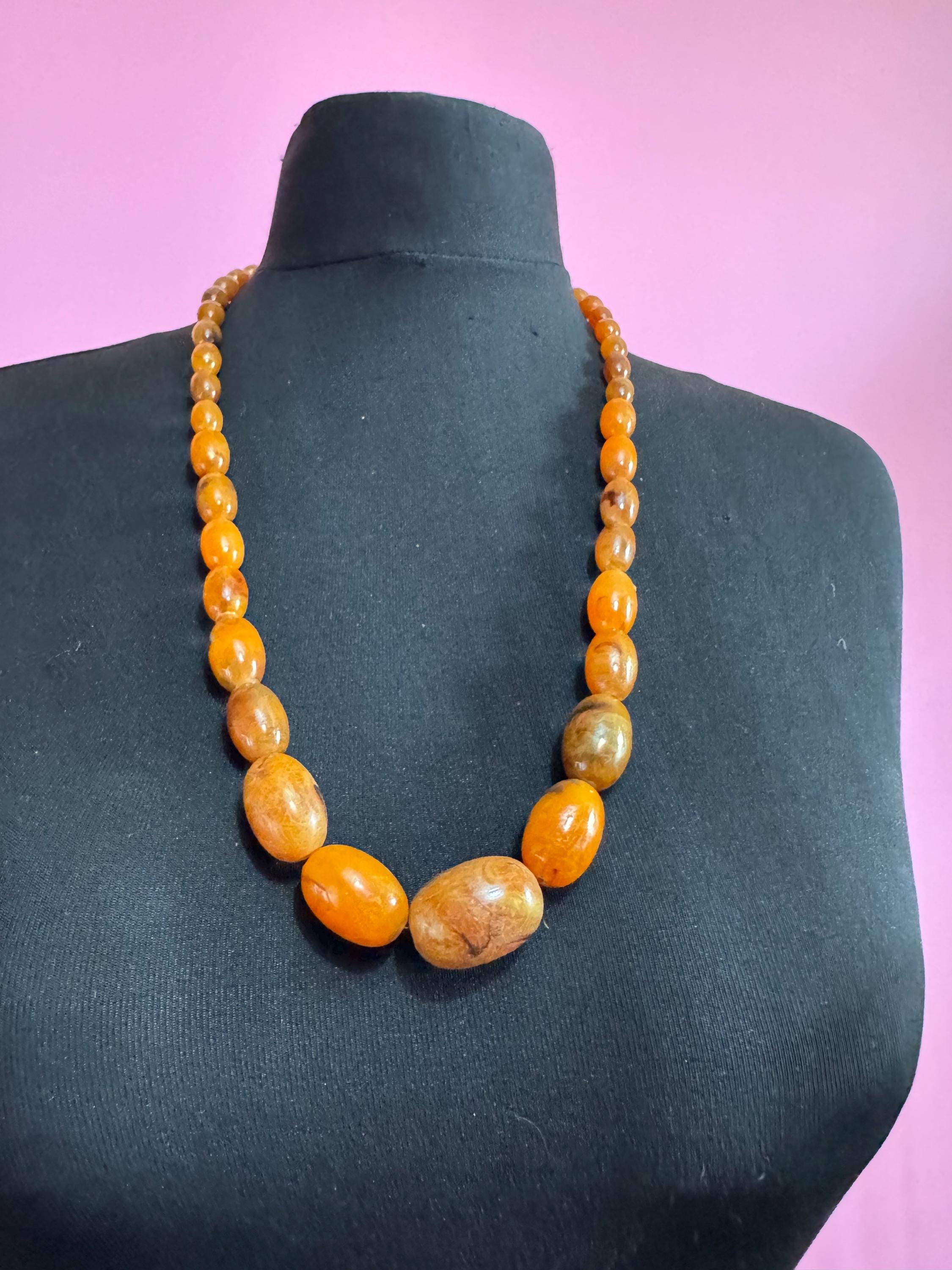 Long Faux Amber orange brown beaded necklace, oval plastic beads
