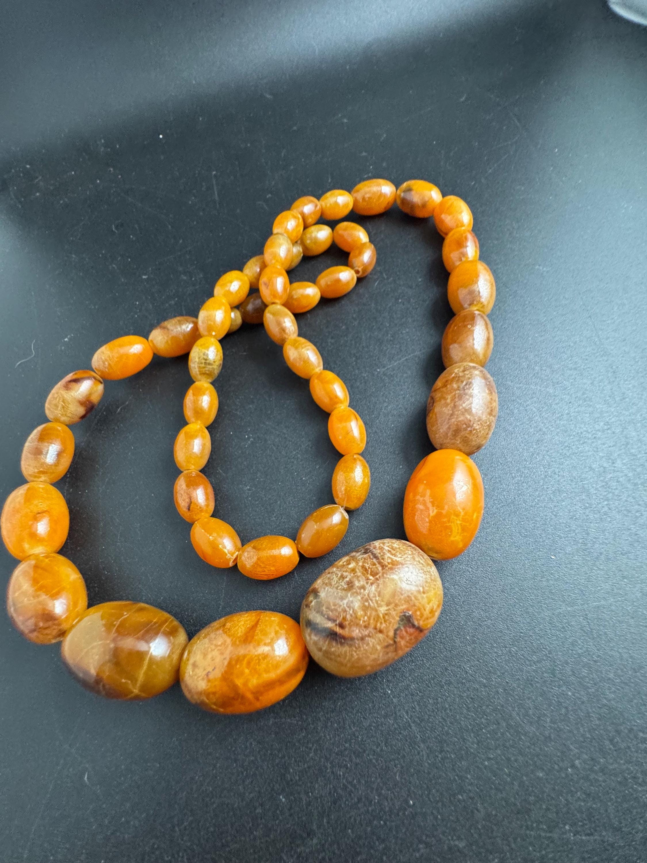 Long Faux Amber orange brown beaded necklace, oval plastic beads