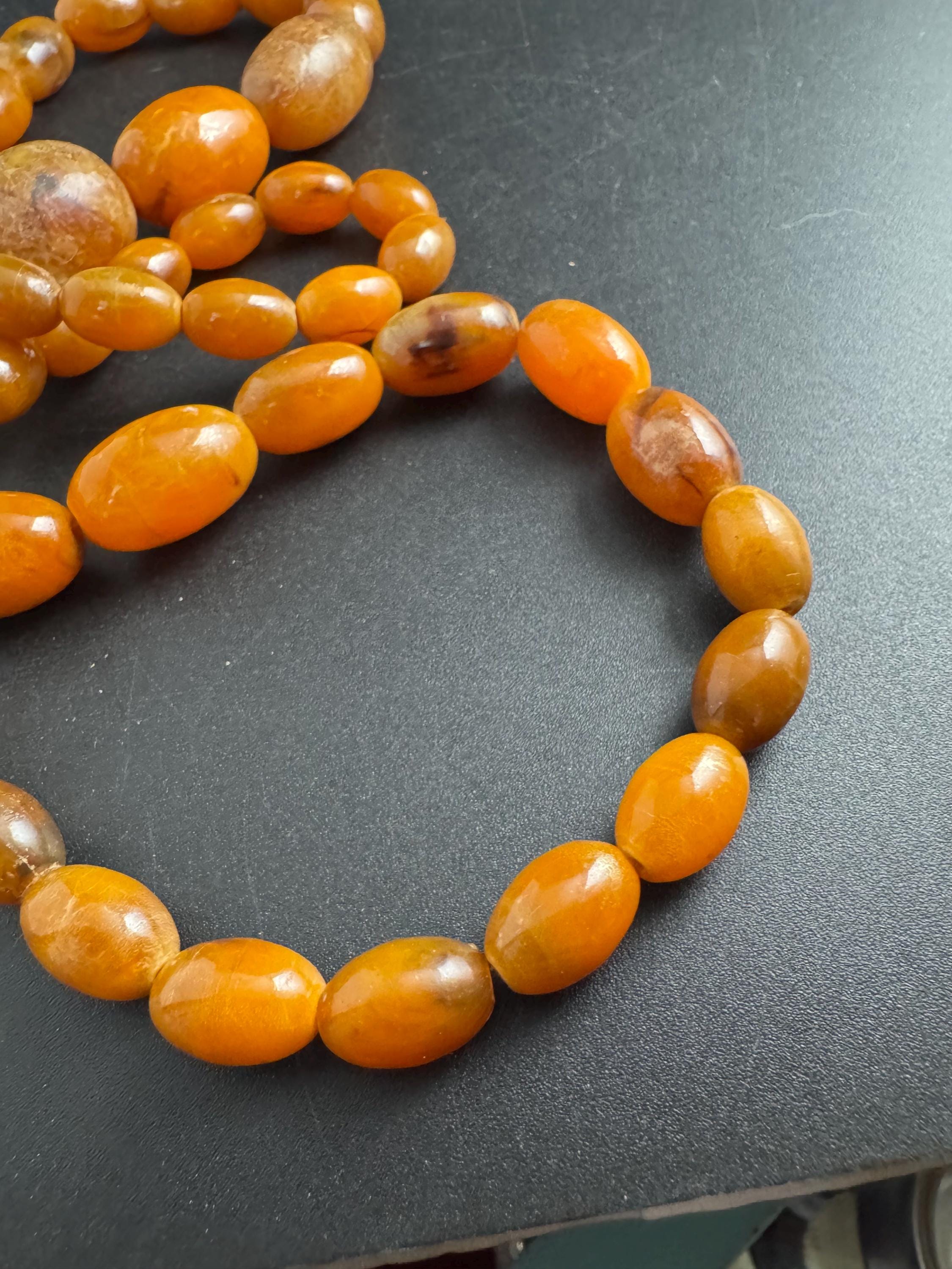 Long Faux Amber orange brown beaded necklace, oval plastic beads