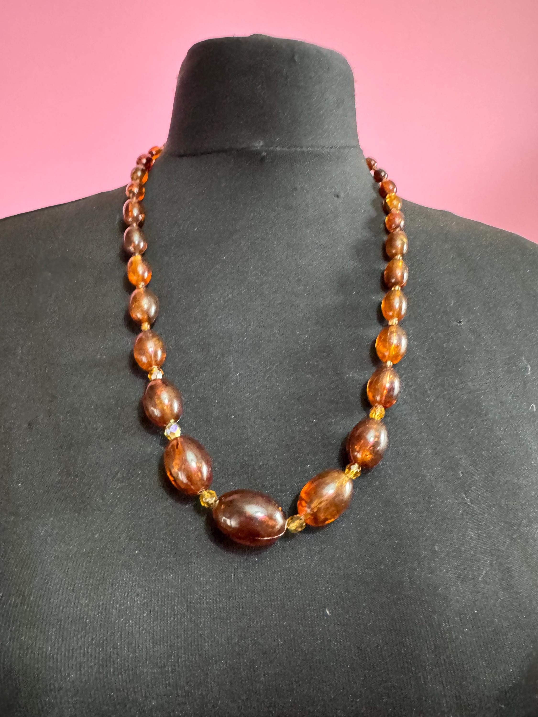 Long Faux Amber orange brown beaded necklace, oval plastic beads