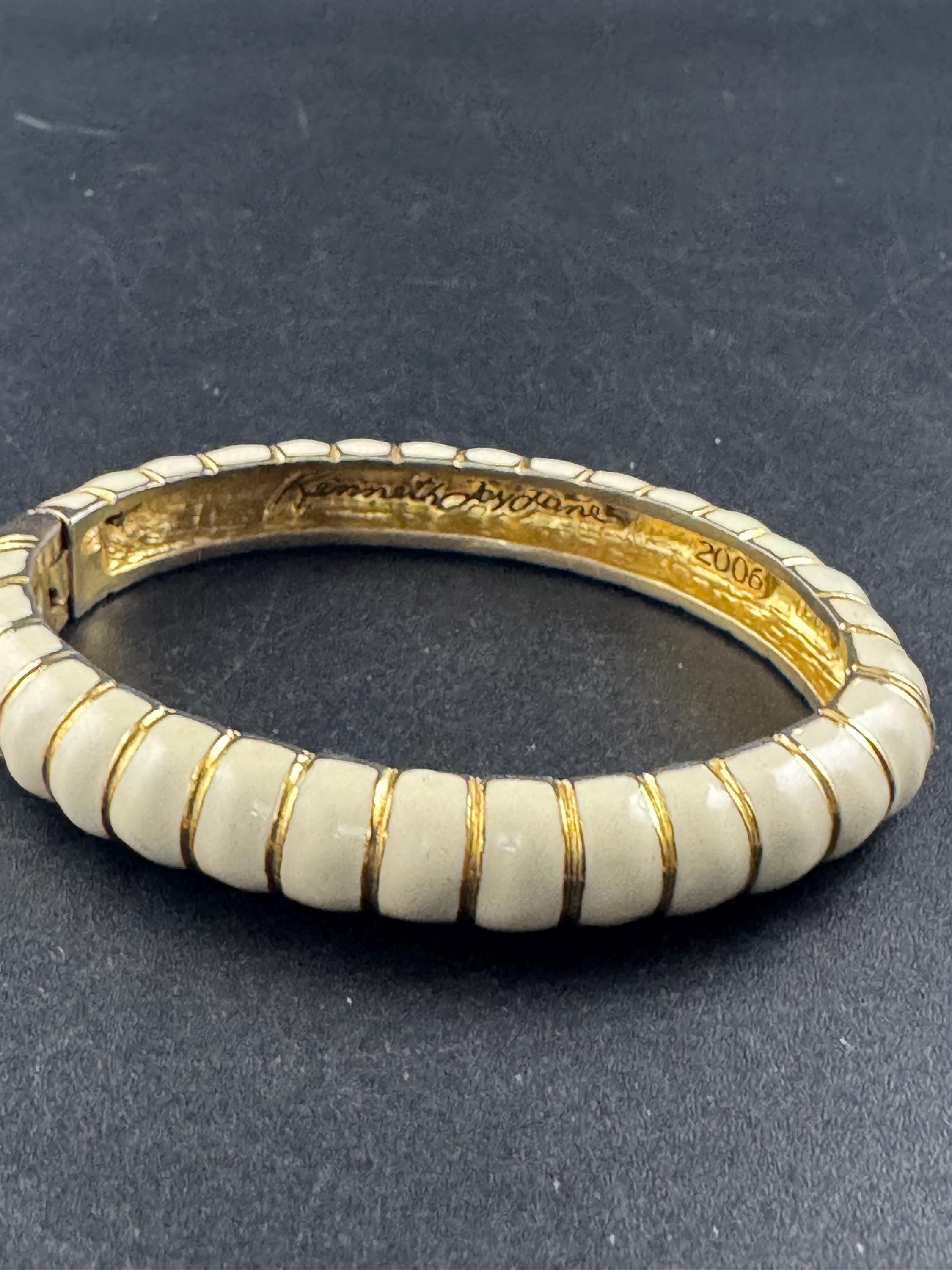 Signed KJL cream enamel clamper bangle, 2006 bracelet by Kenneth j lane