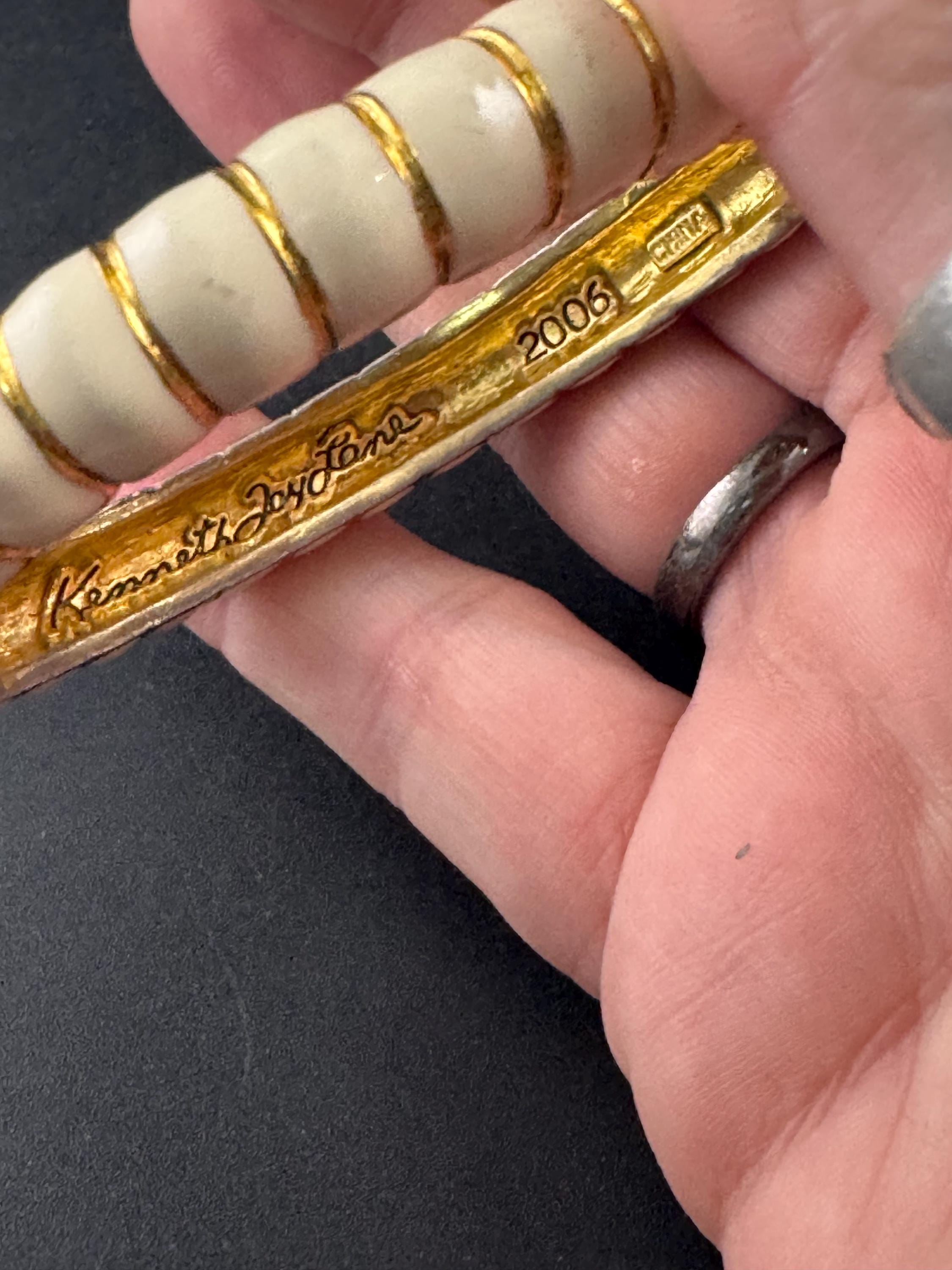 Signed KJL cream enamel clamper bangle, 2006 bracelet by Kenneth j lane