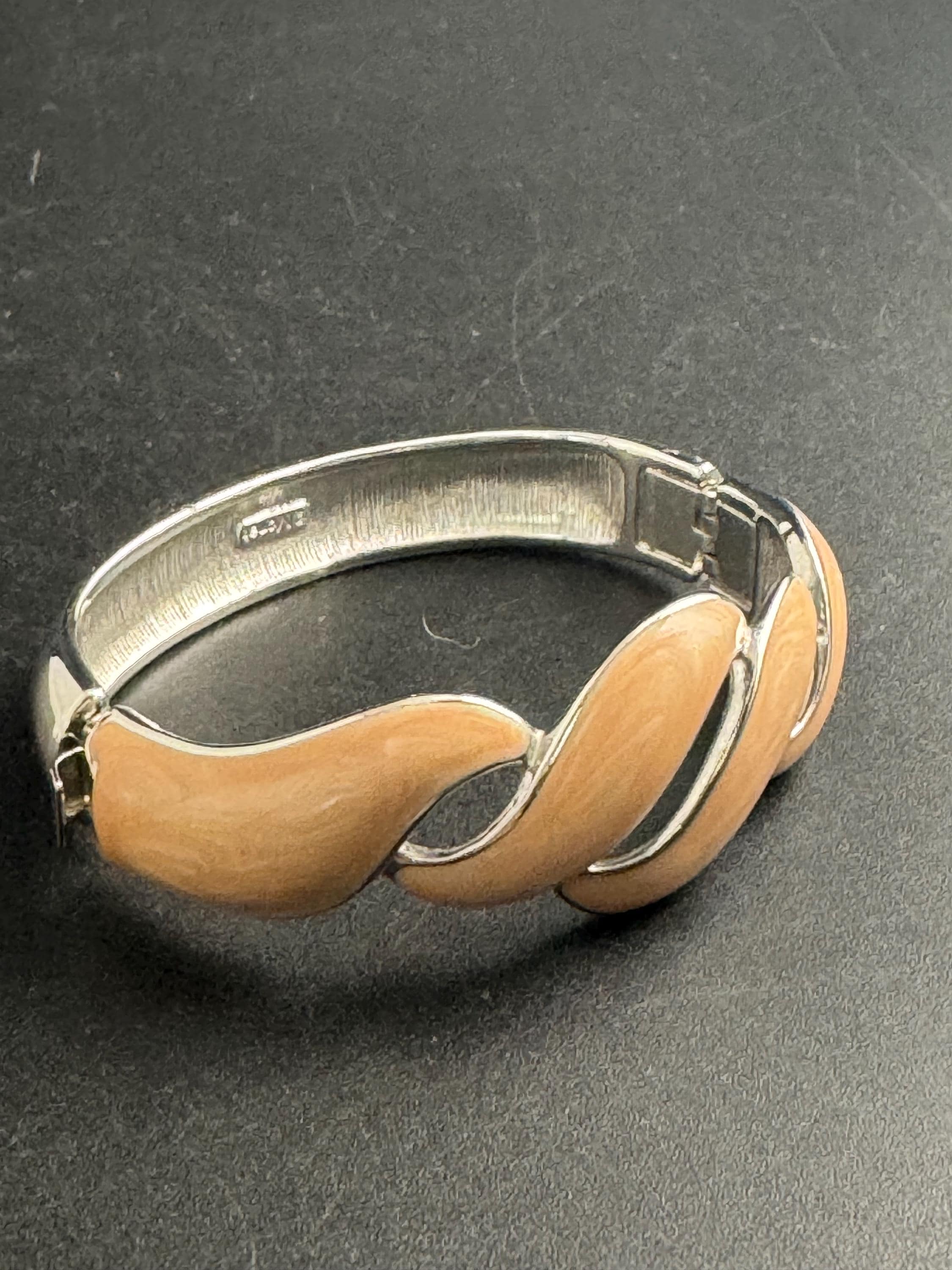 Beige enamel Monet bangle , silver tone clamper and signed
