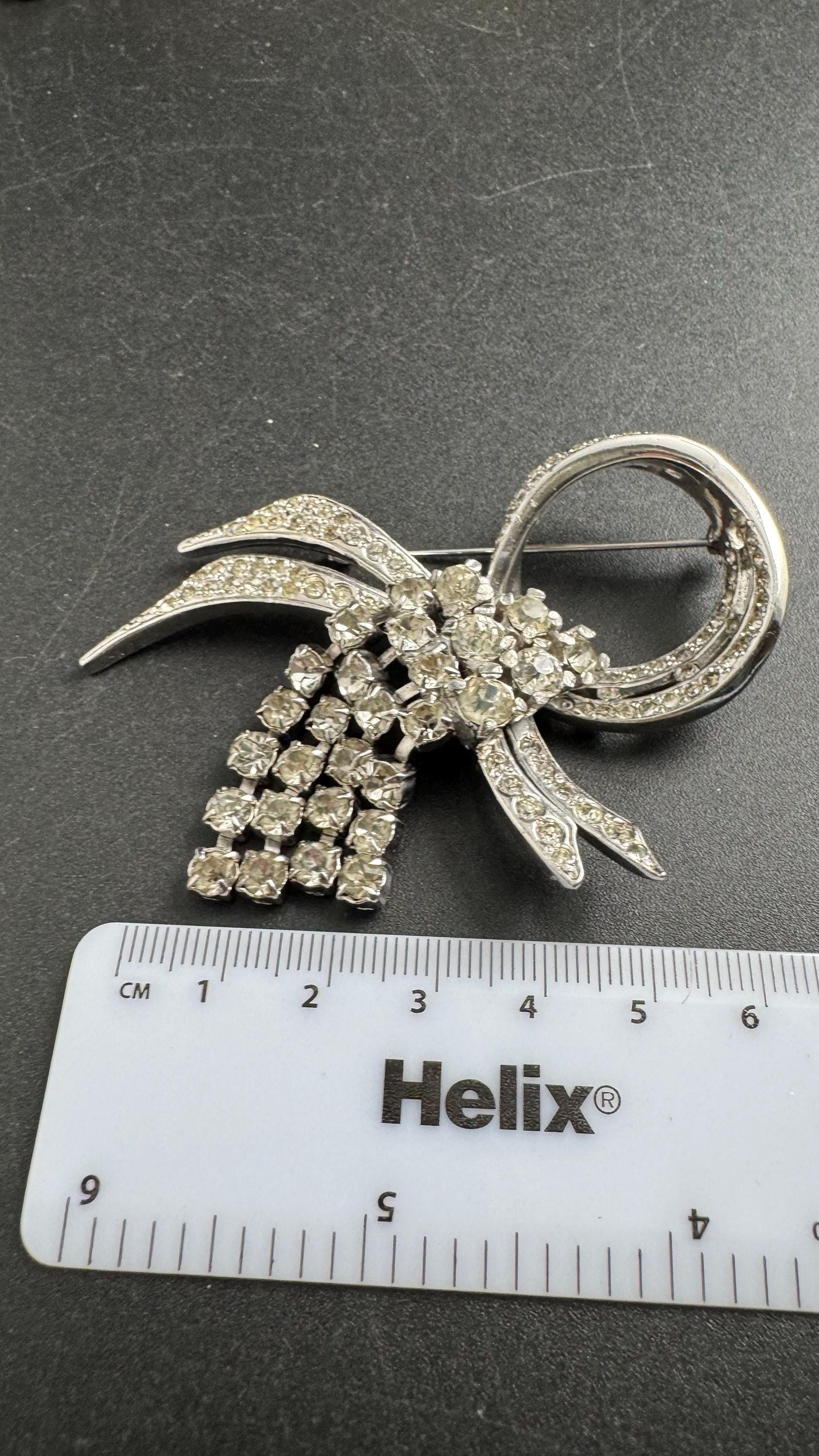 Large clear rhinestone tassel brooch, chrome back vintage quality