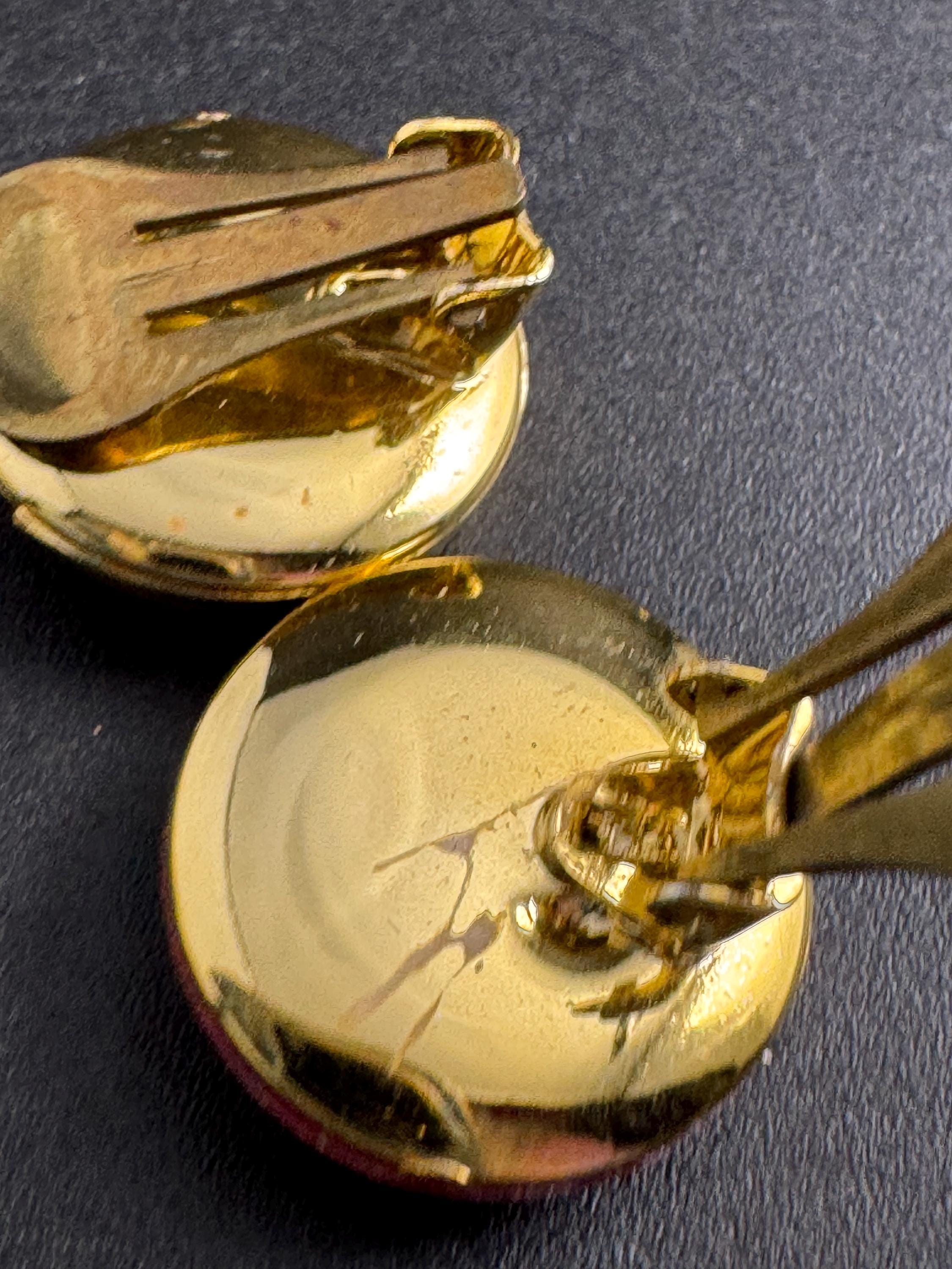 Bright red gold clip on earrings, vintage early plastic swirl