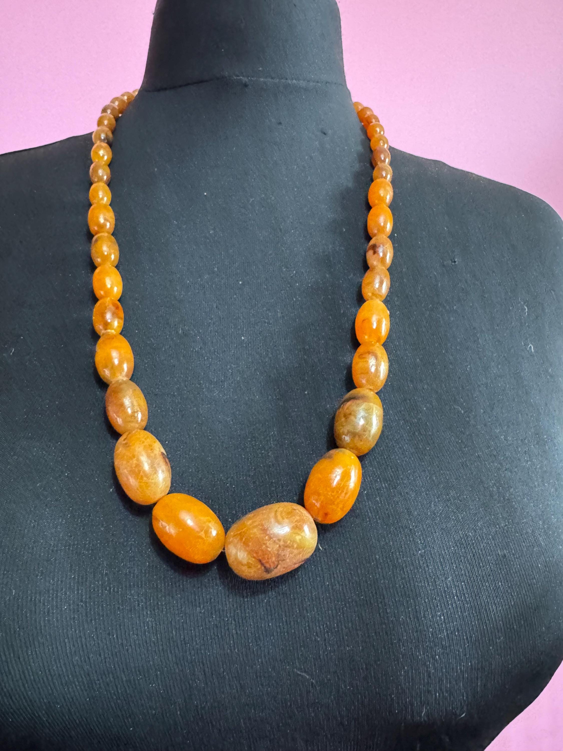 Long Faux Amber orange brown beaded necklace, oval plastic beads