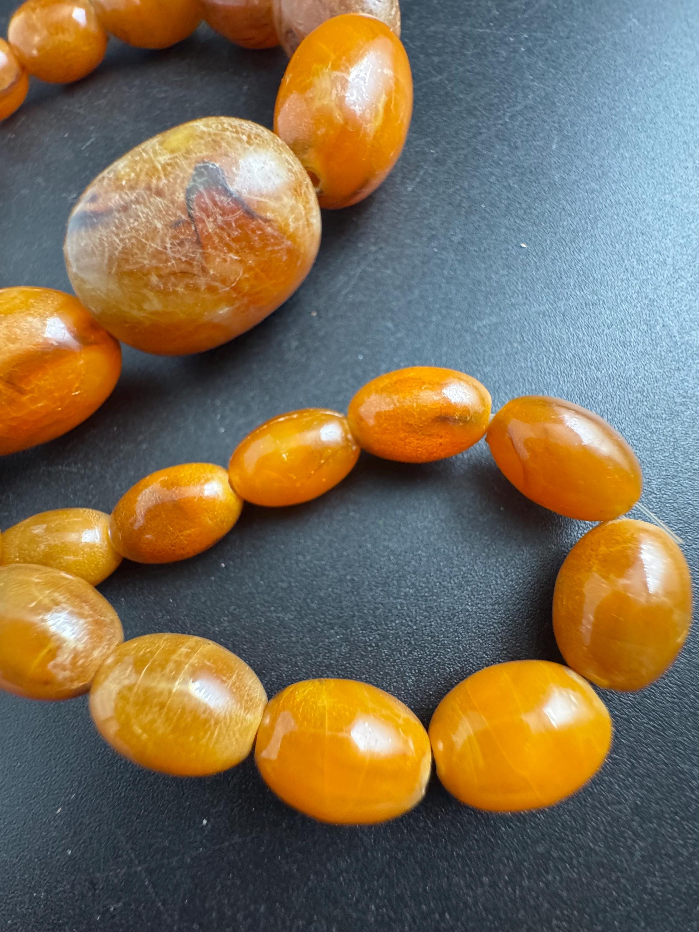 Long Faux Amber orange brown beaded necklace, oval plastic beads