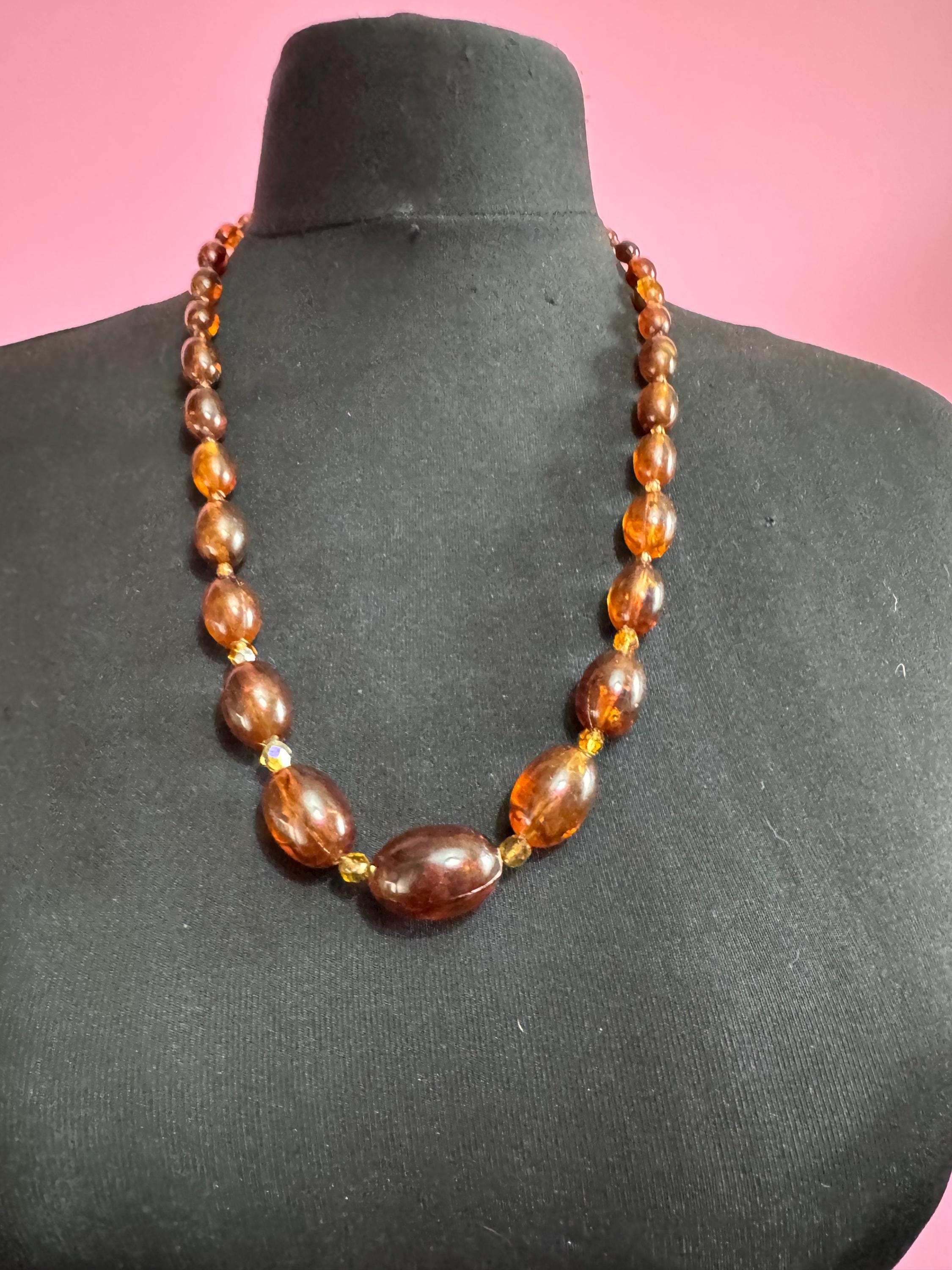Long Faux Amber orange brown beaded necklace, oval plastic beads