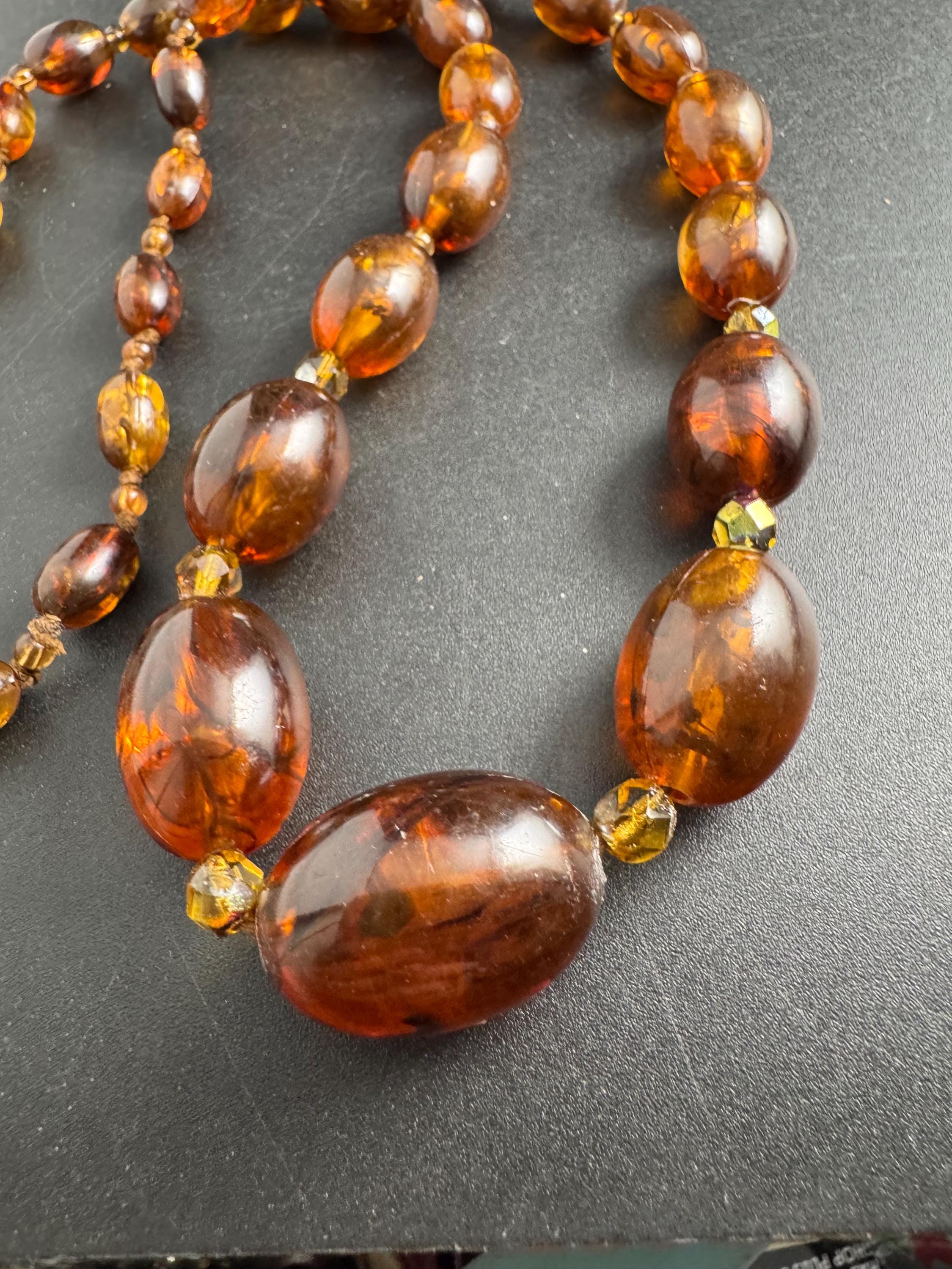Long Faux Amber orange brown beaded necklace, oval plastic beads