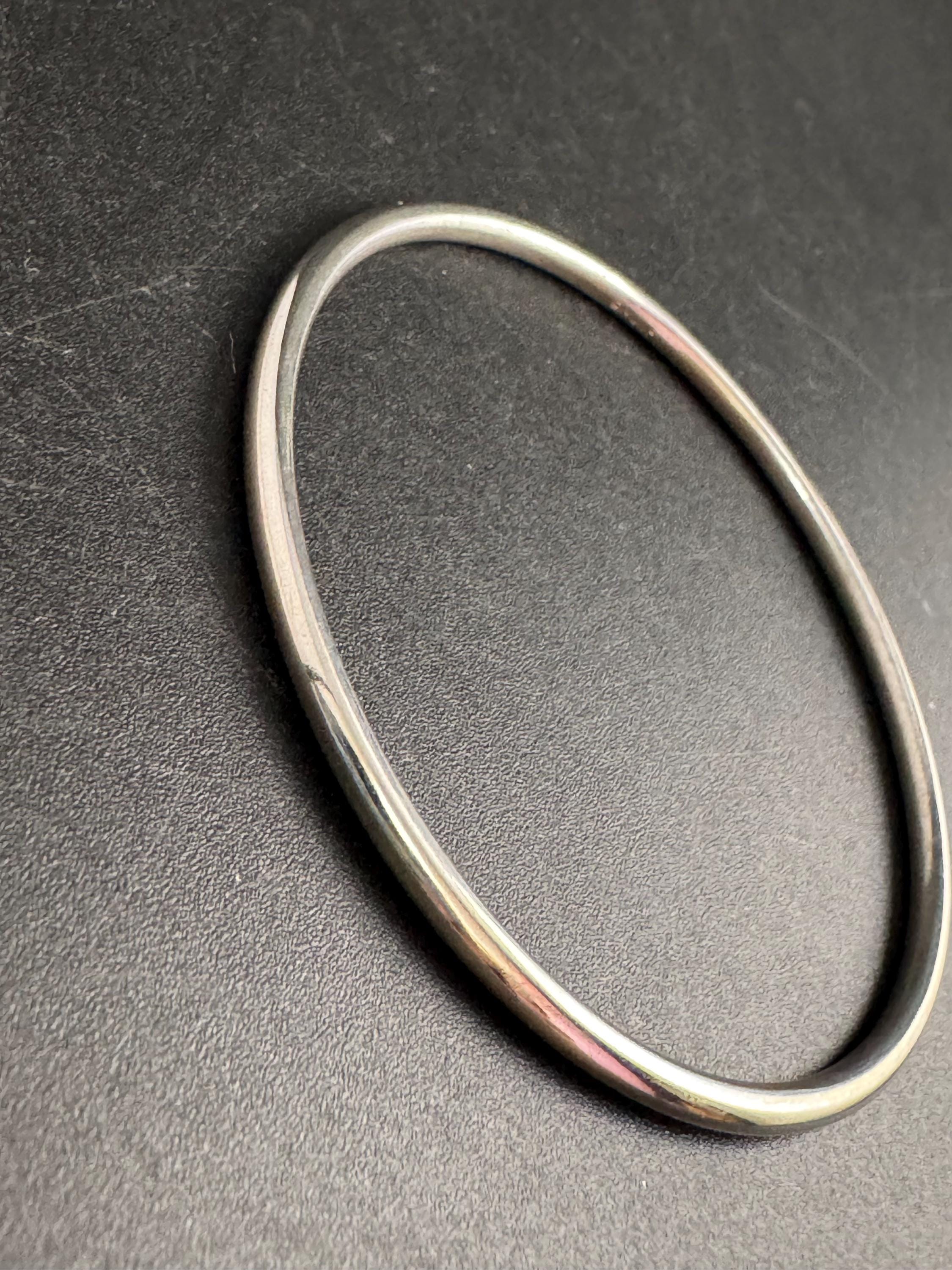 Monet slim stacking bangle , silver tone vintage and signed