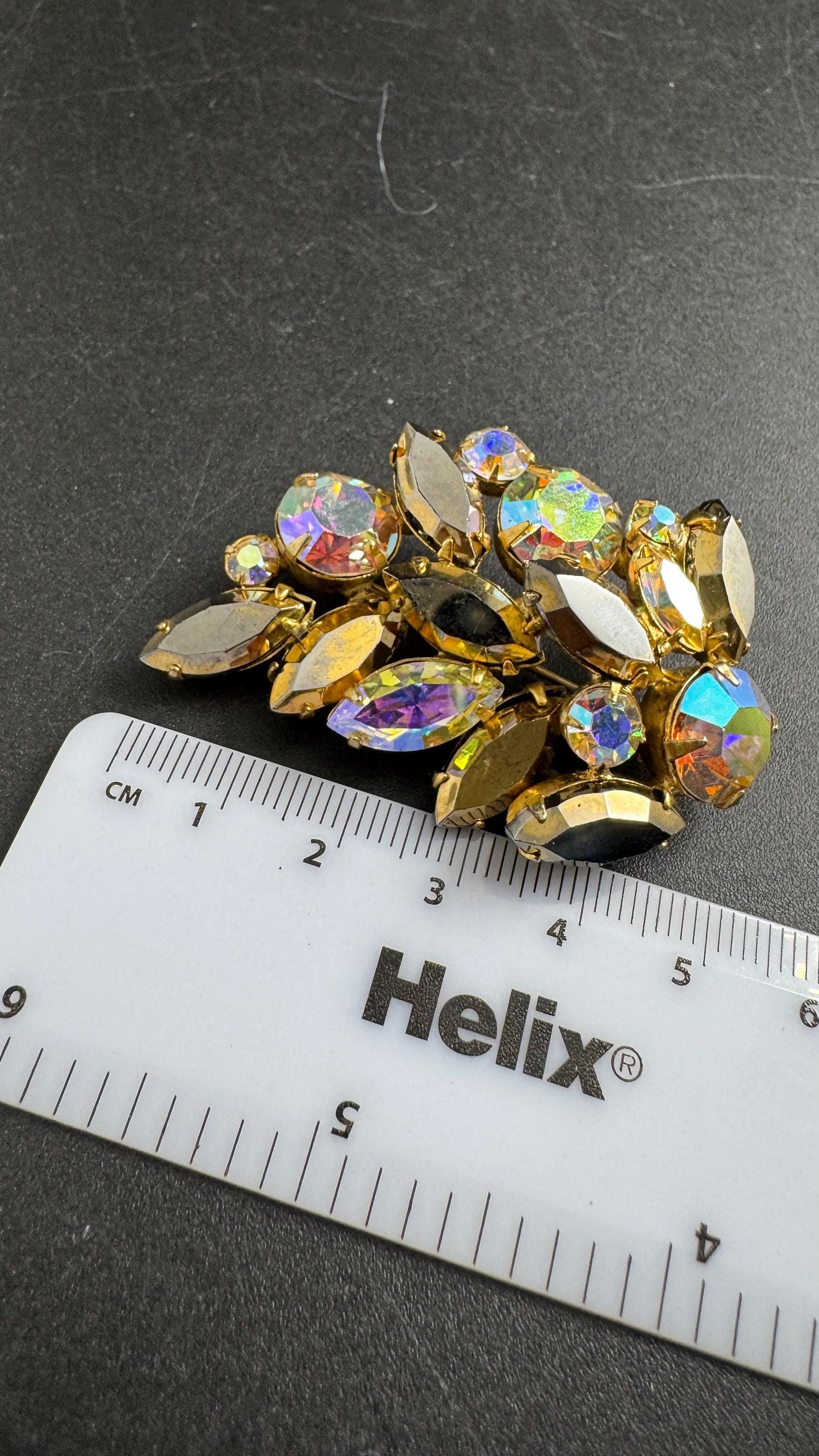 Regency AB rhinestone brooch, Aurora borealis and bronze stones