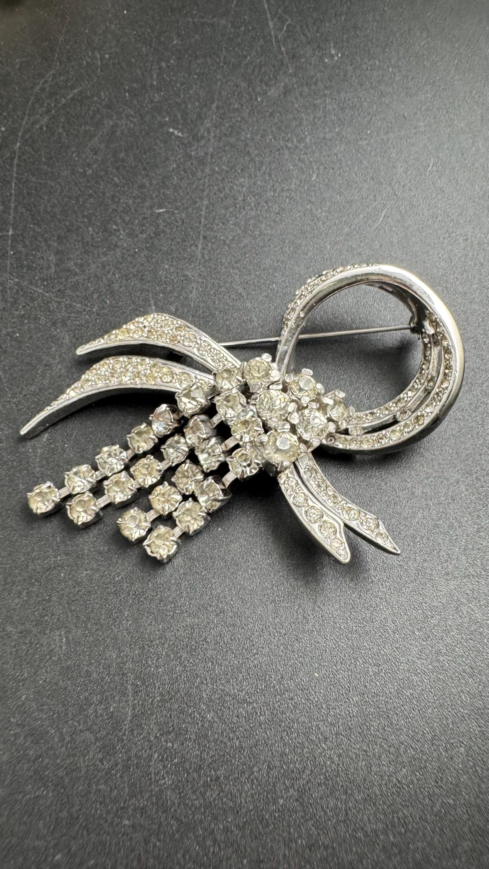 Large clear rhinestone tassel brooch, chrome back vintage quality