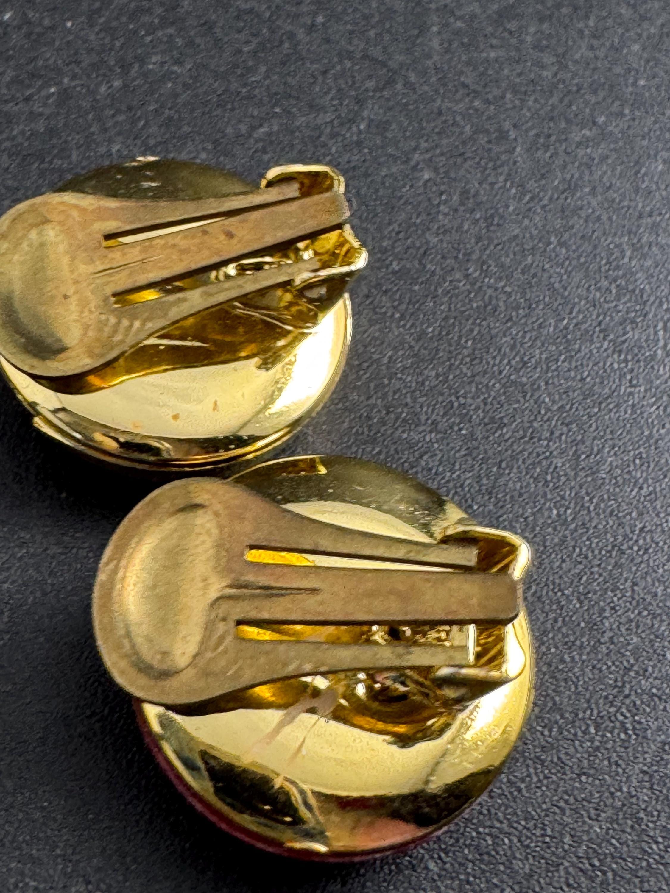 Bright red gold clip on earrings, vintage early plastic swirl