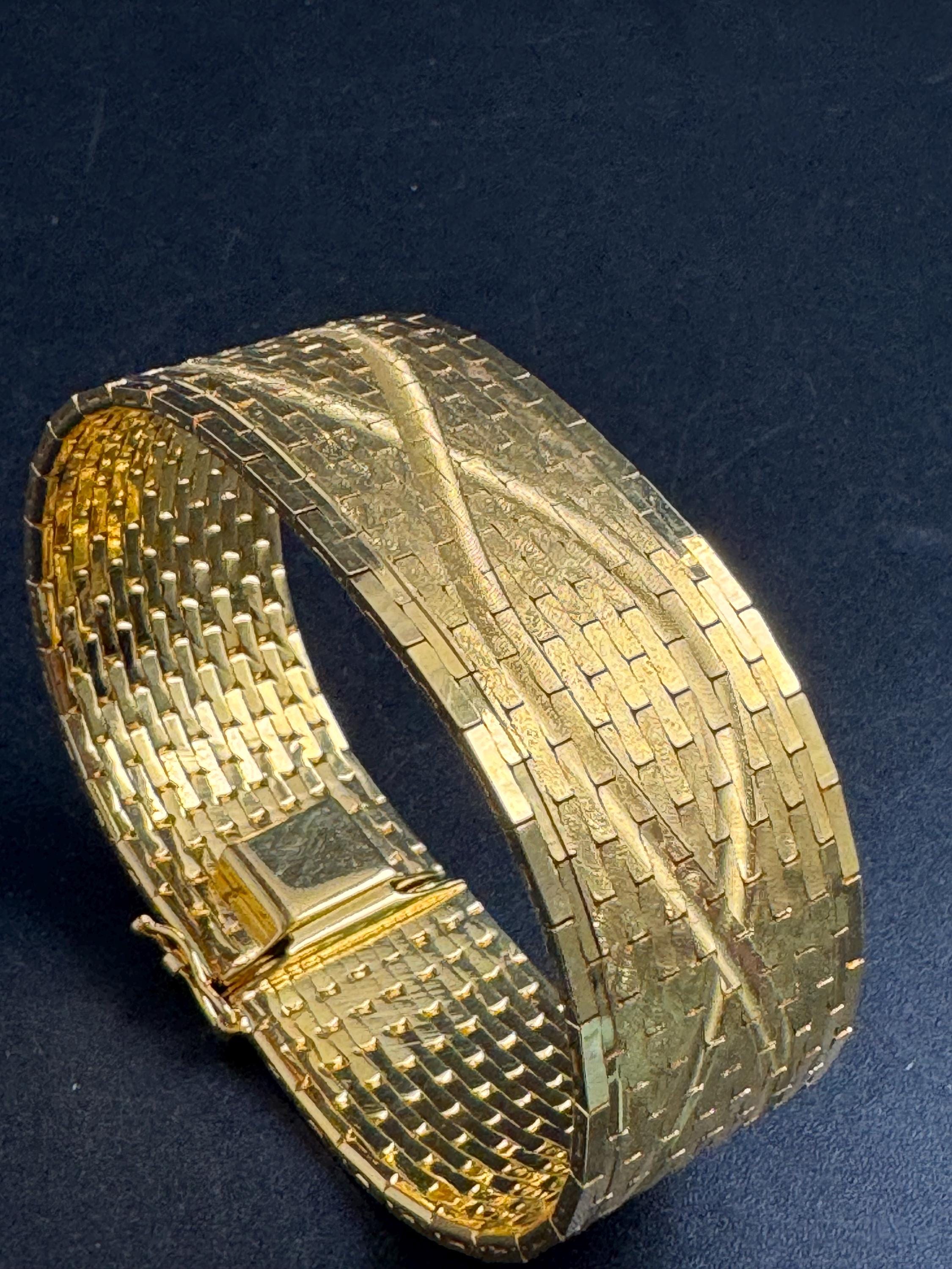 Wide gold plated flat bracelet, articulated 1970s