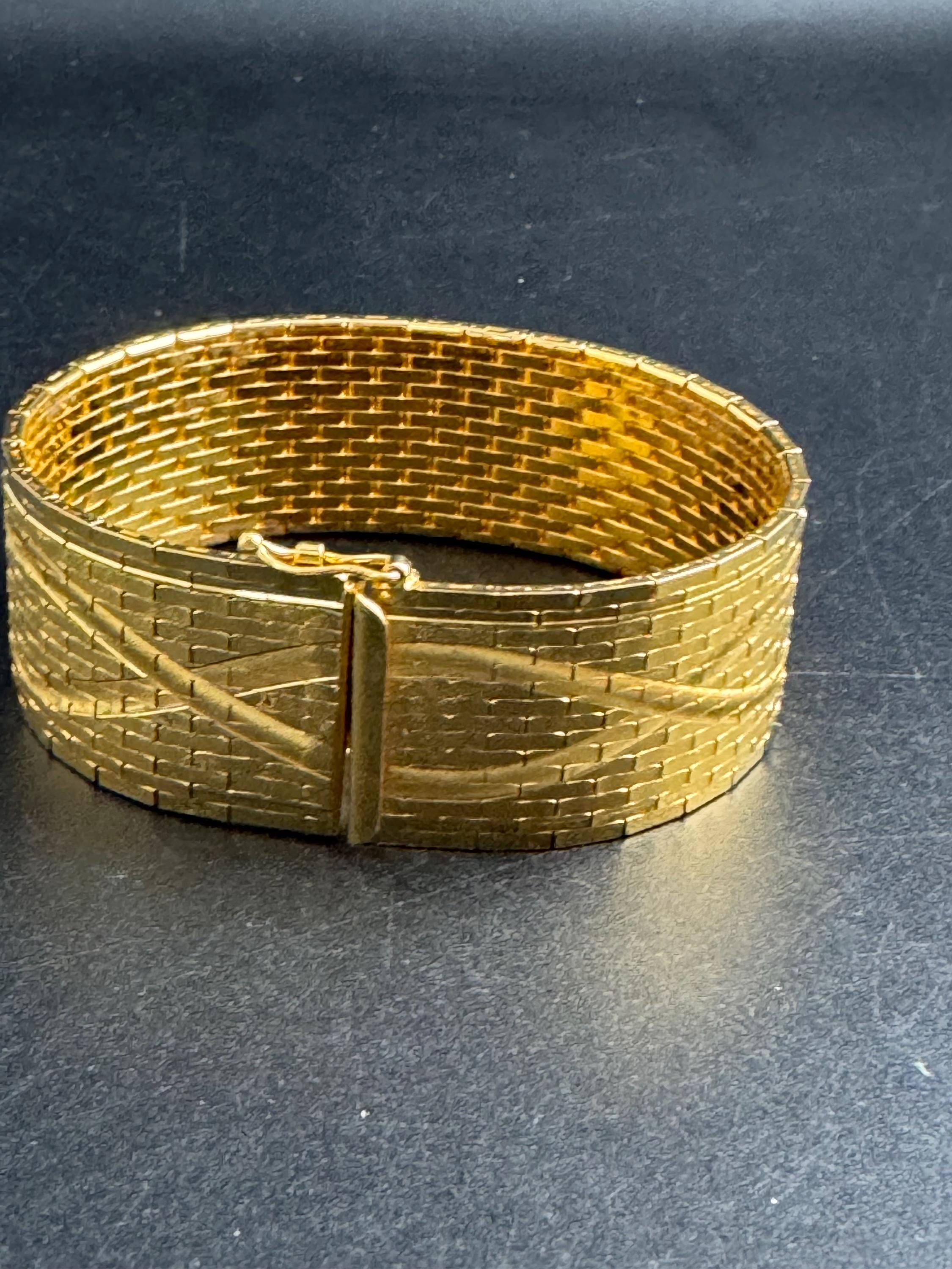 Wide gold plated flat bracelet, articulated 1970s