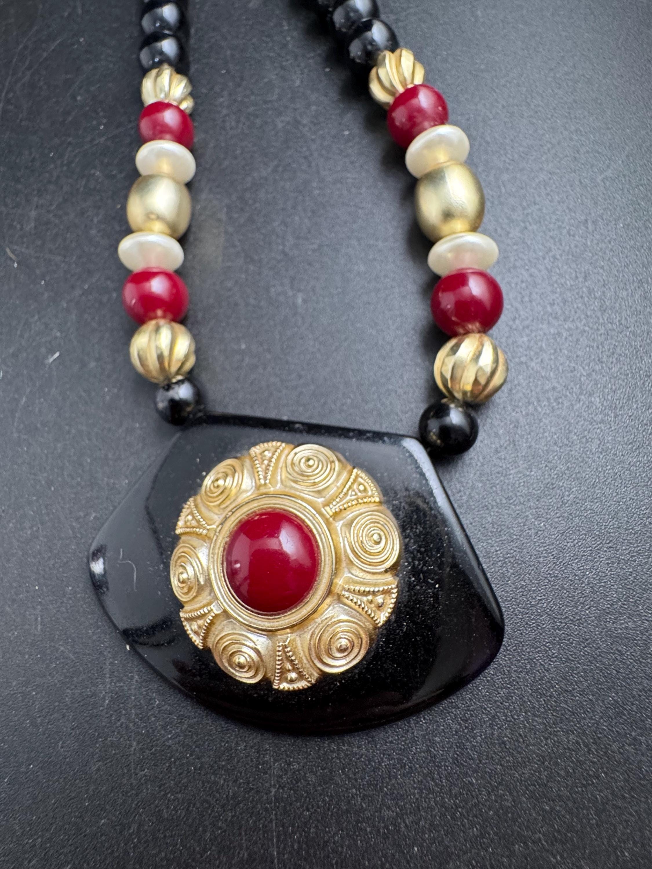 Black beaded statement necklace, red gold acrylic pendant