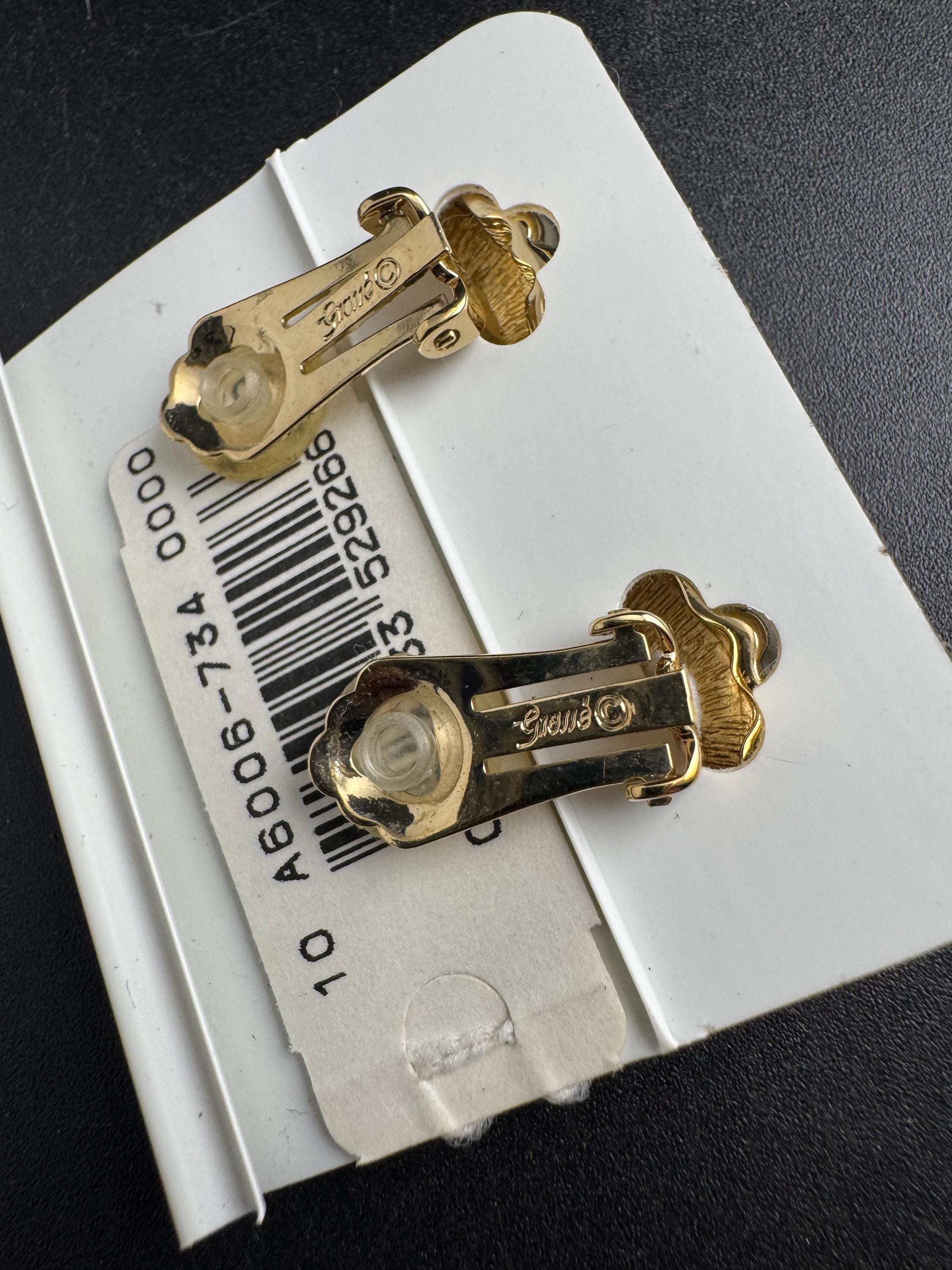 Grosse gold plated clip on earrings, unused vintage stock designer and fully signed