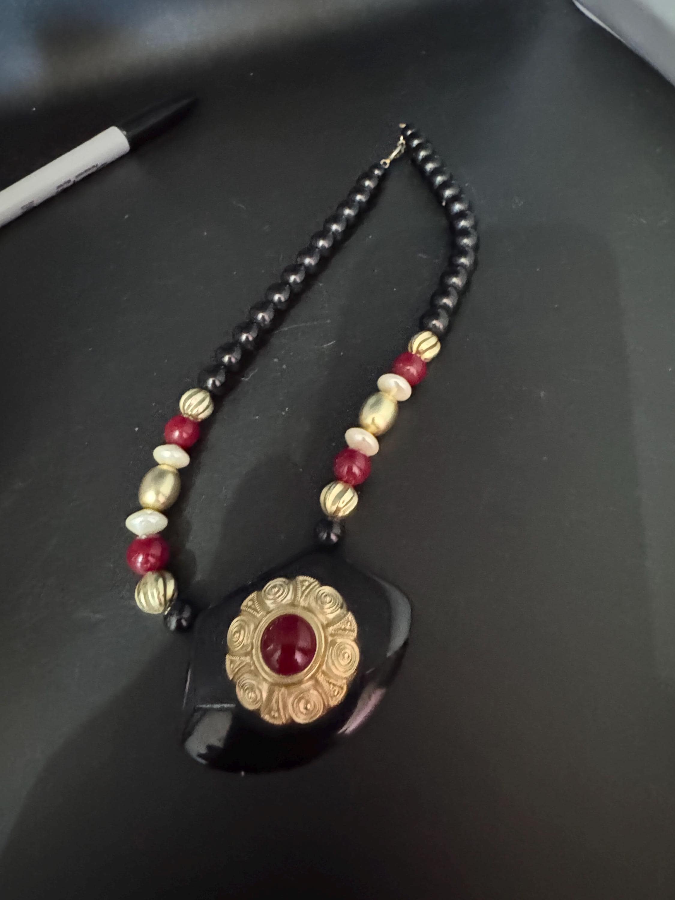 Black beaded statement necklace, red gold acrylic pendant