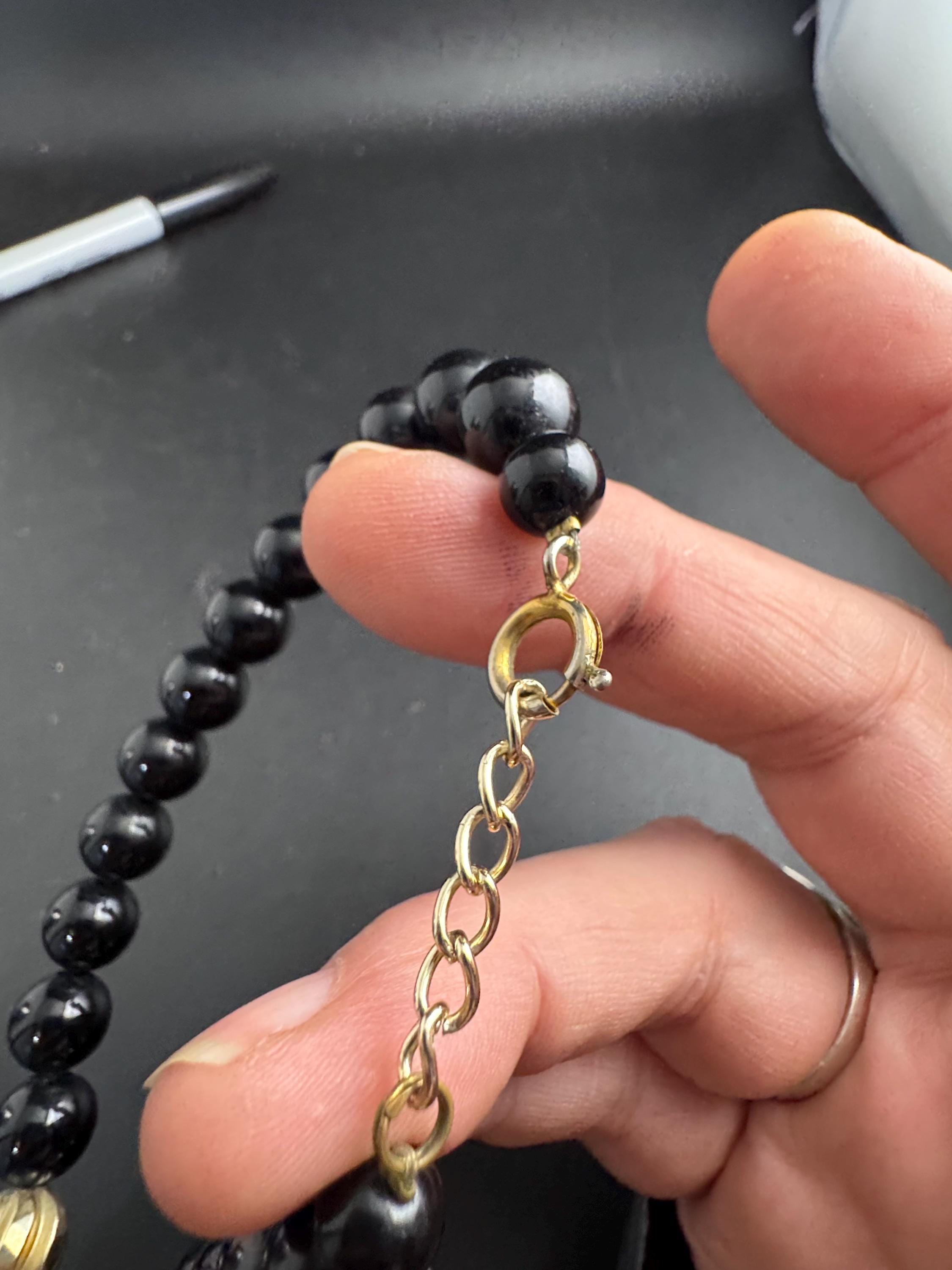 Black beaded statement necklace, red gold acrylic pendant