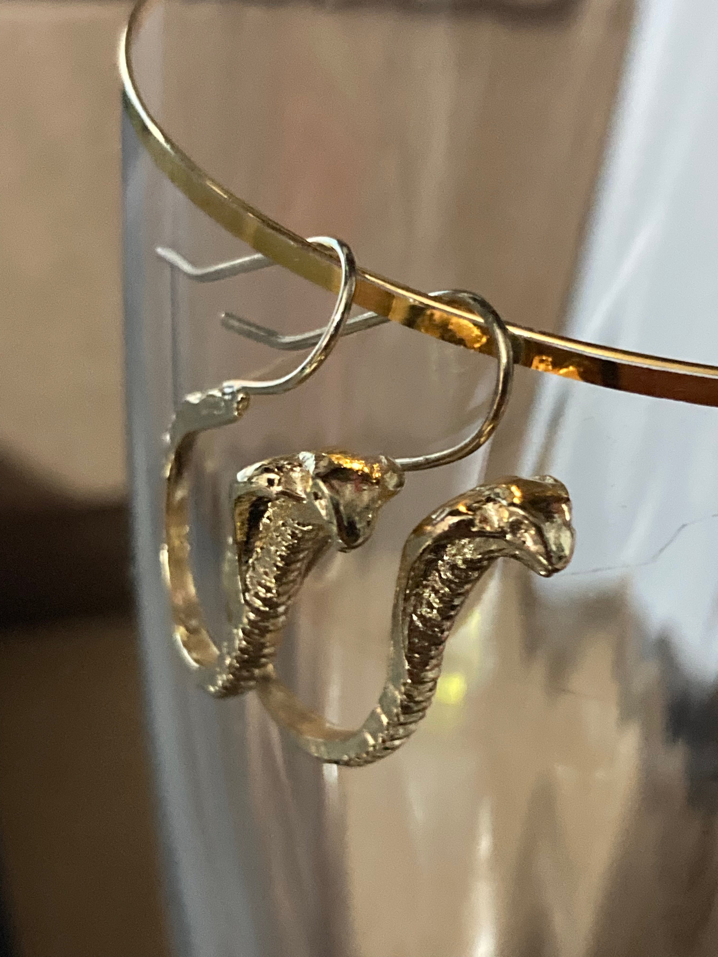 Small gold tone snake earrings