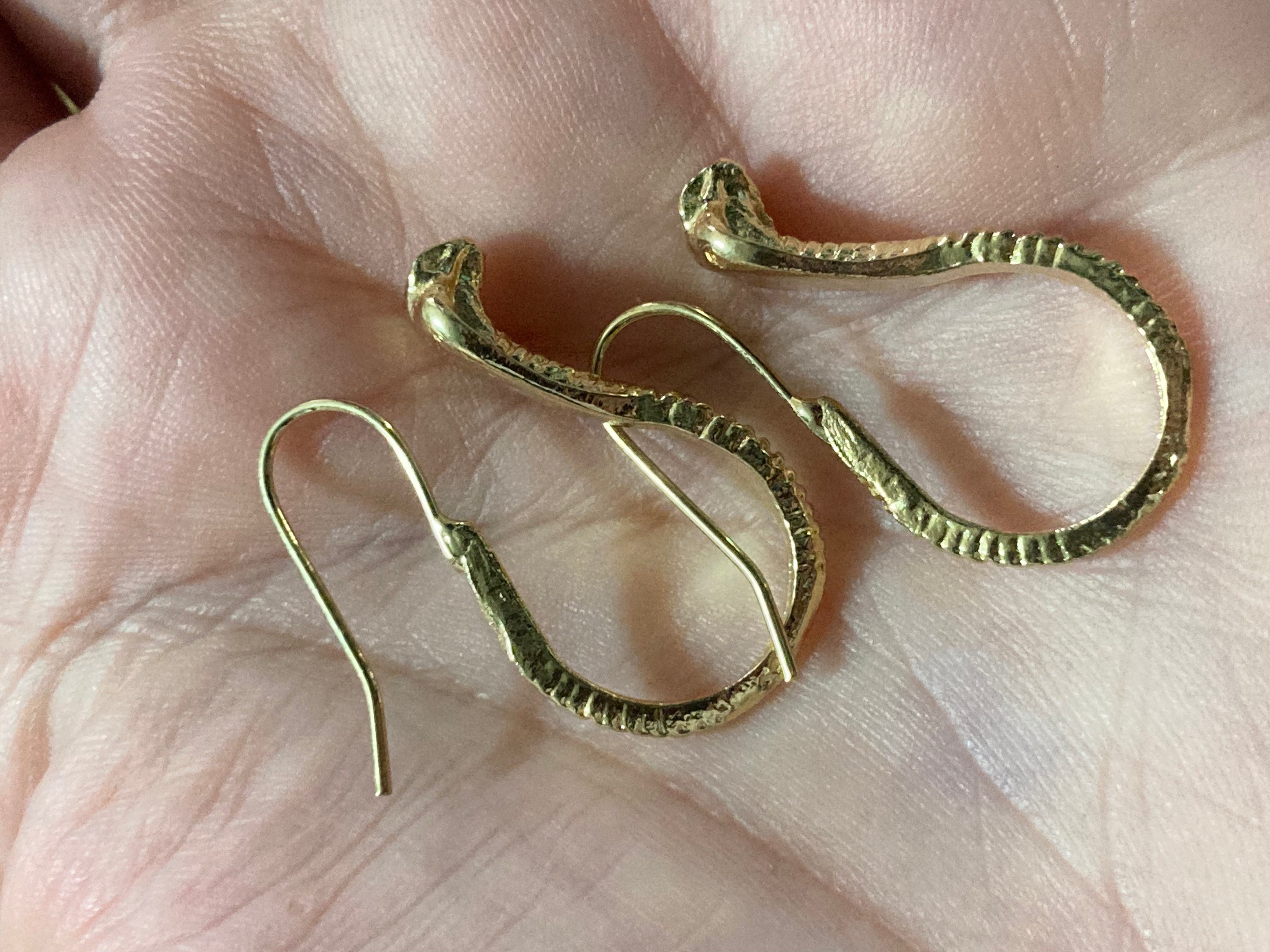 Small gold tone snake earrings