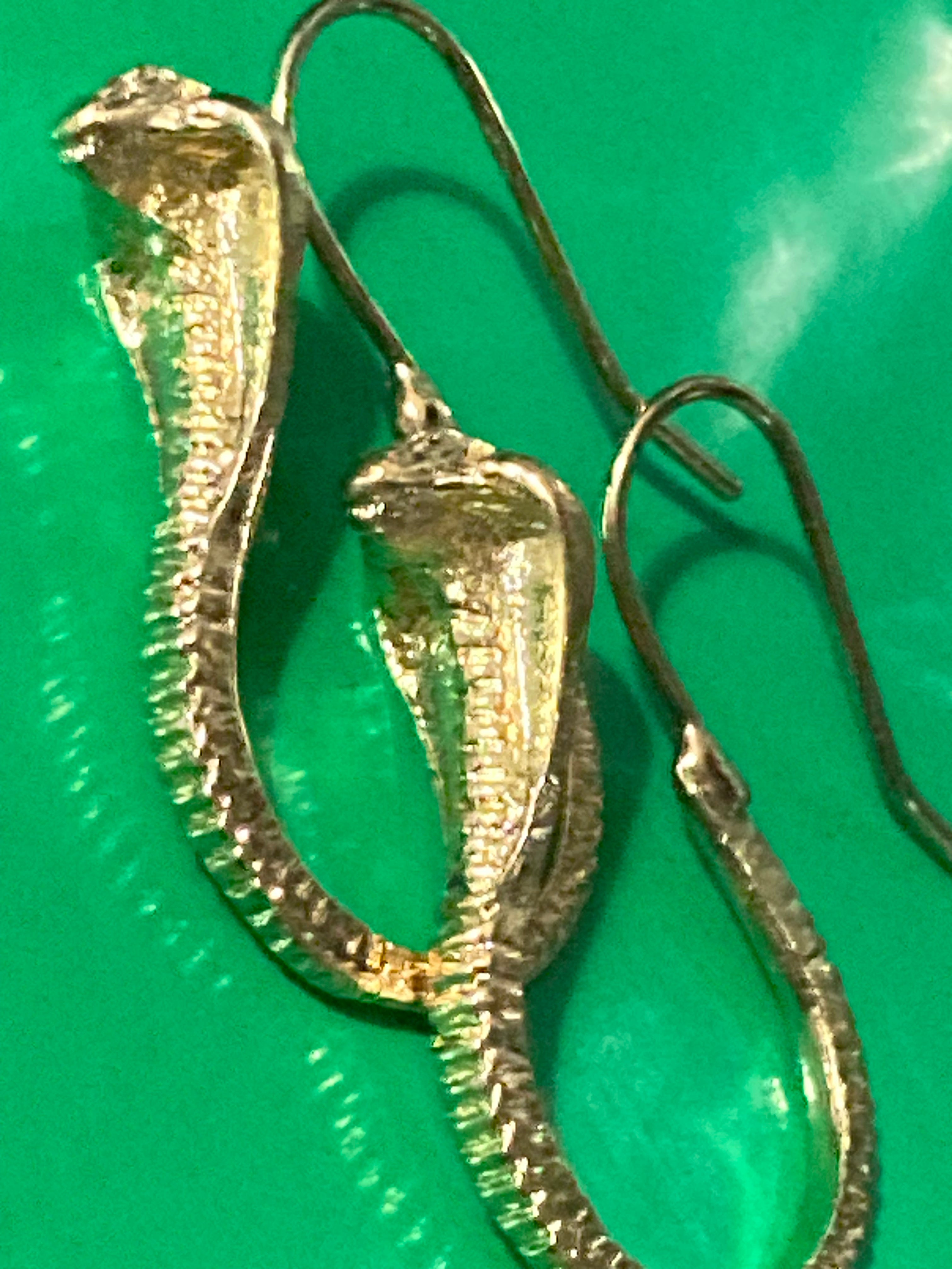 Small gold tone snake earrings