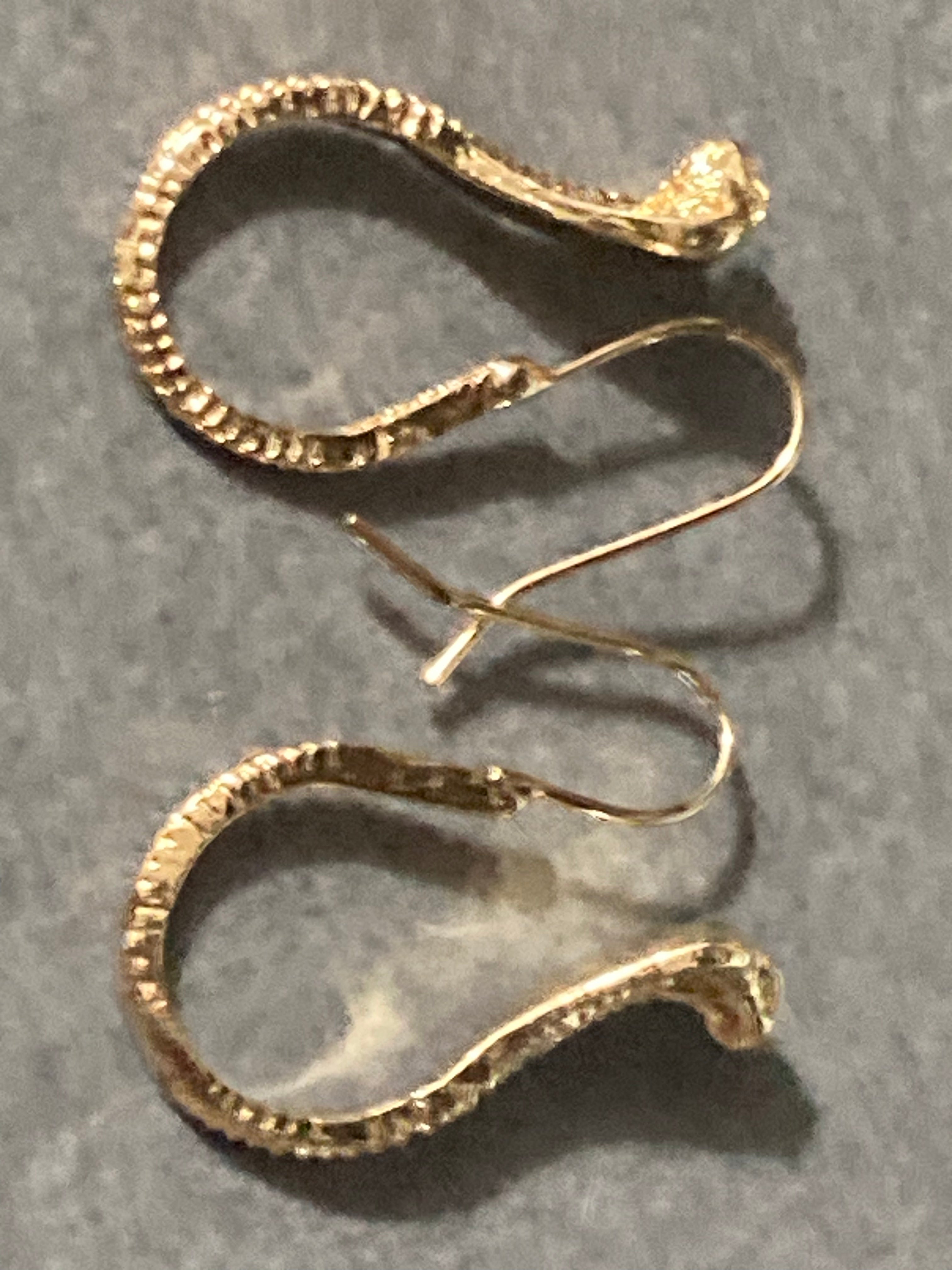 Small gold tone snake earrings