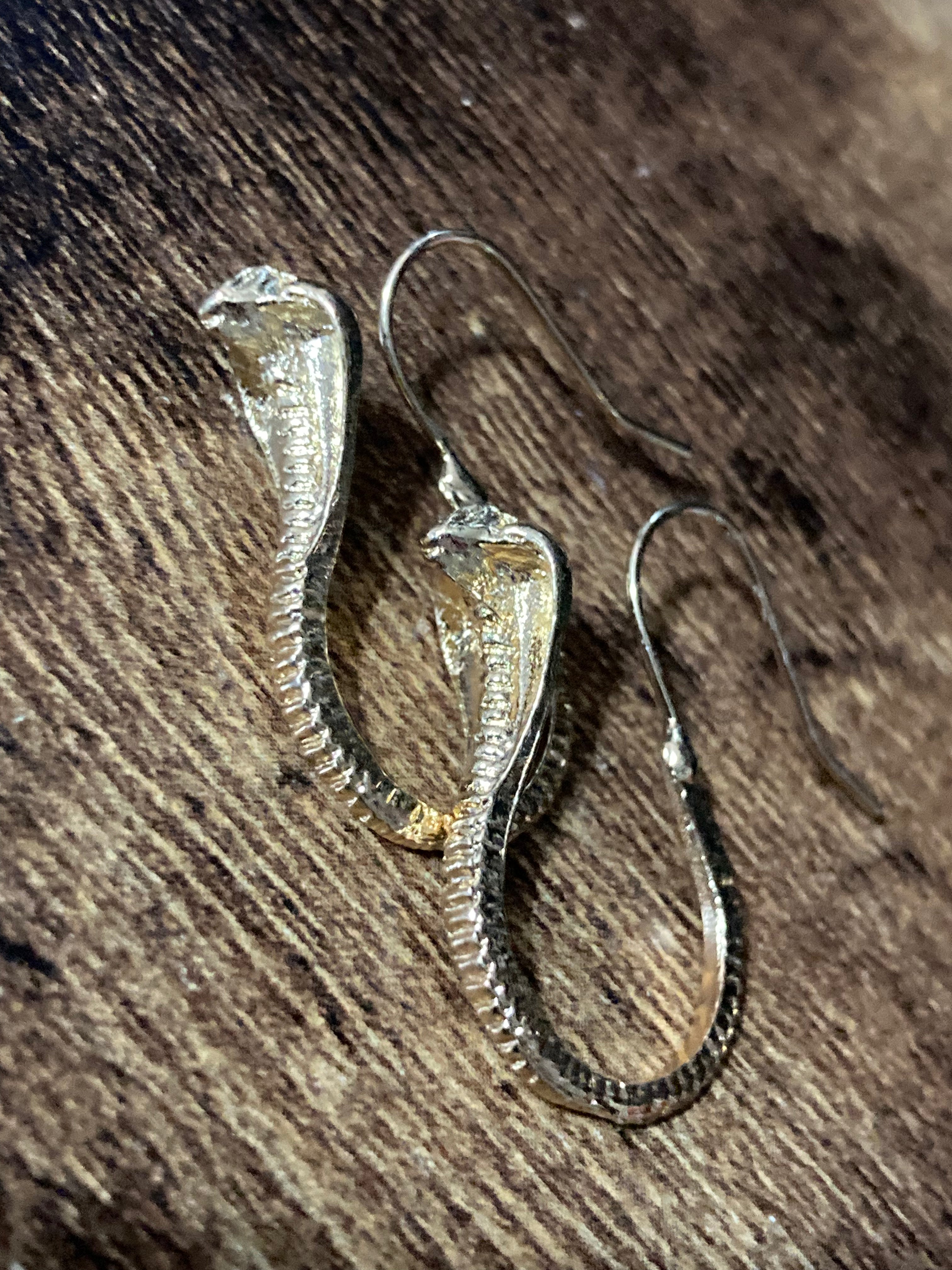 Small gold tone snake earrings