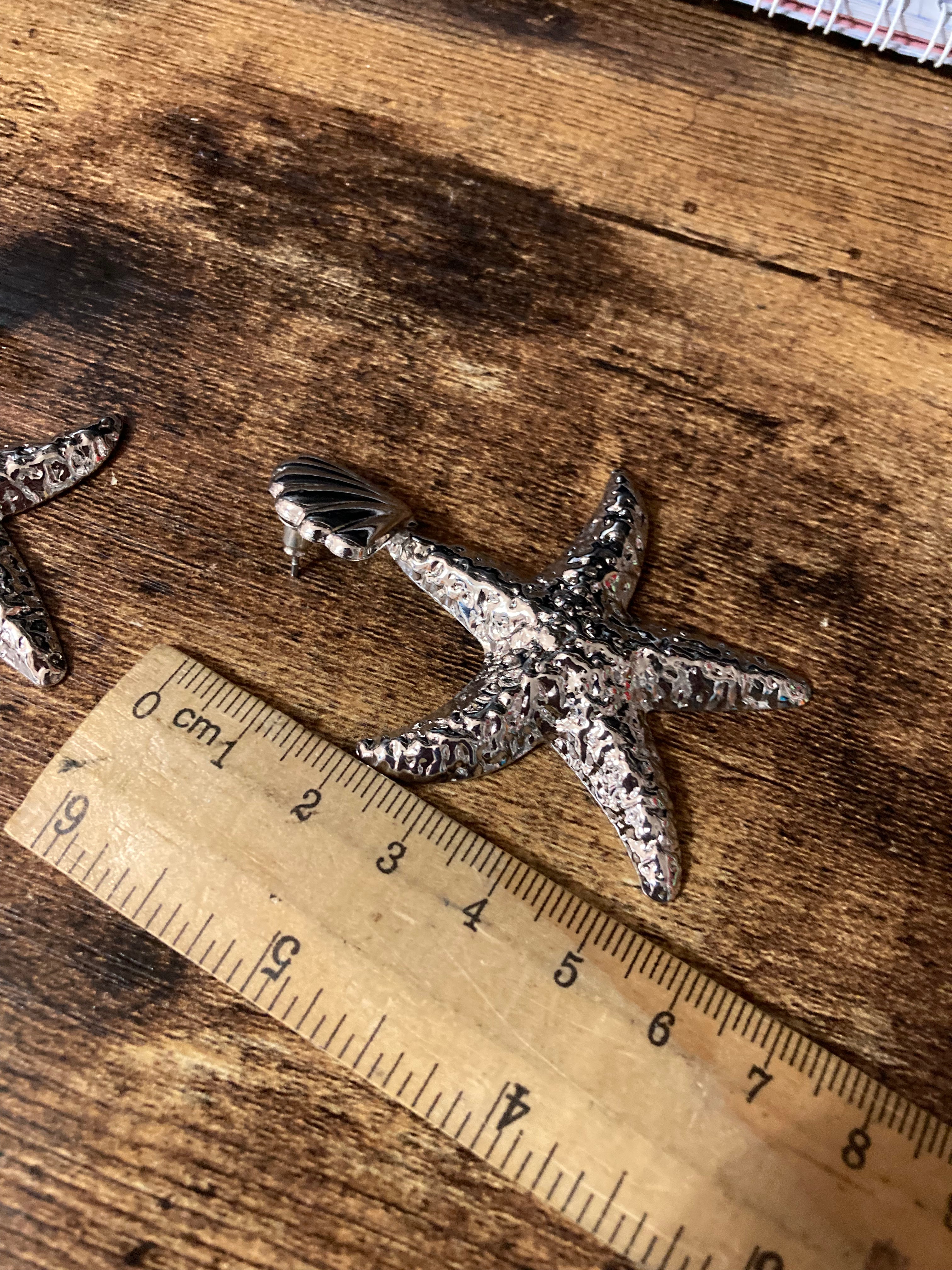 Oversized silver metal starfish earrings