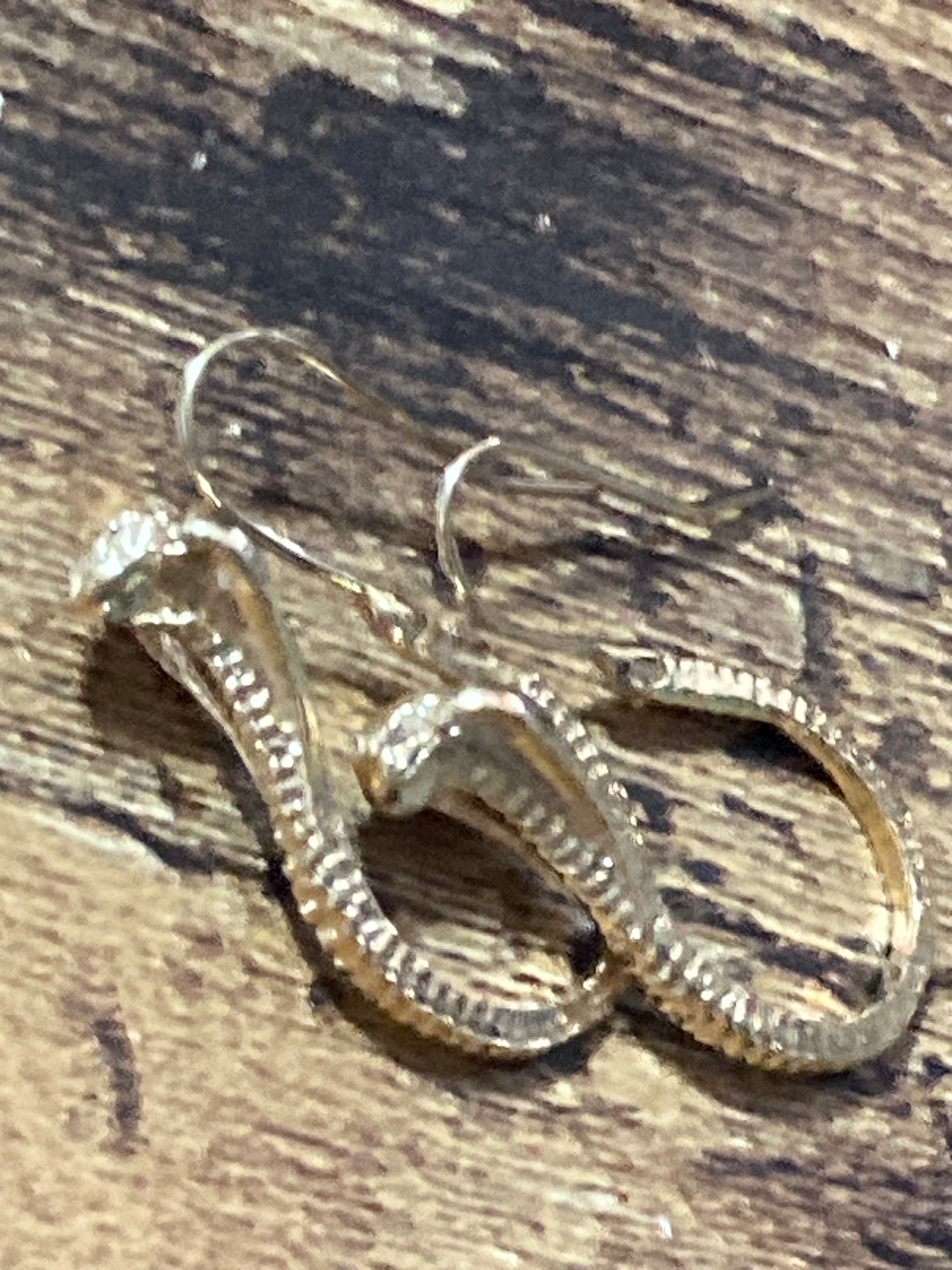 Small gold tone snake earrings