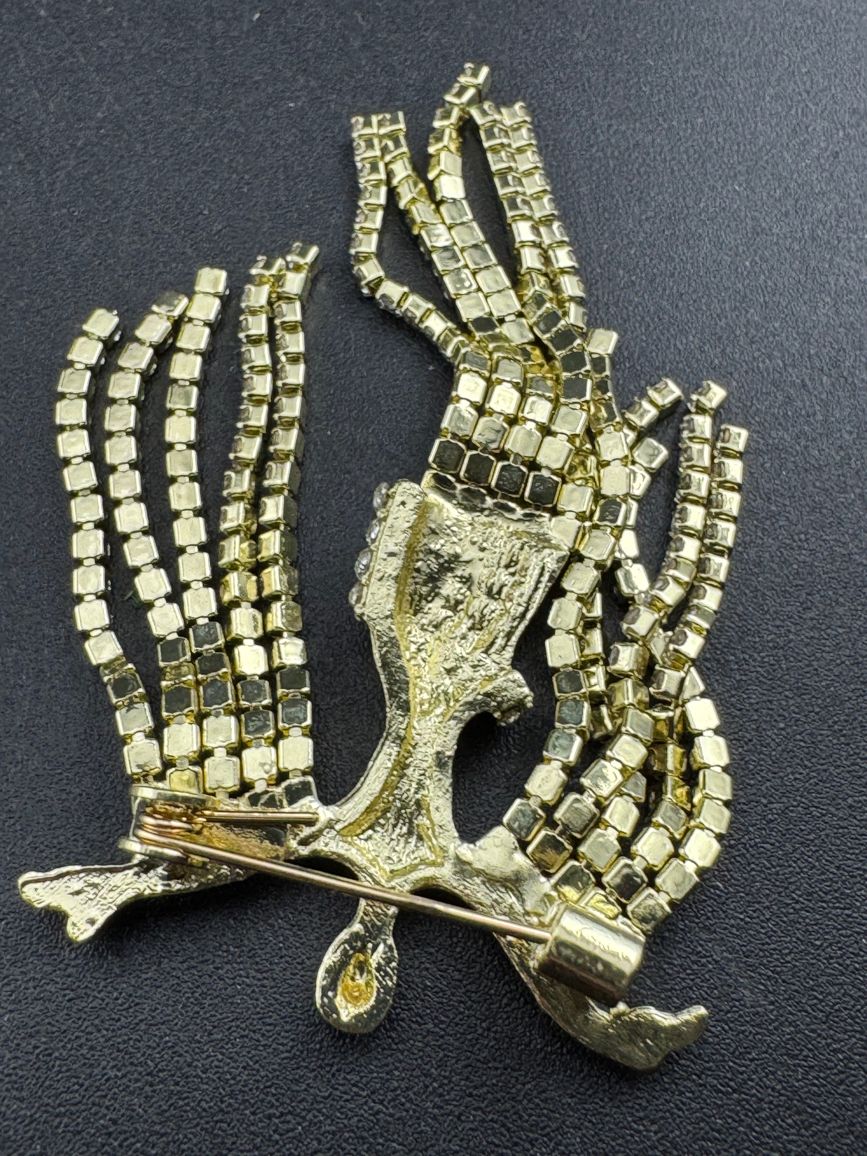 Gold rhinestone diva brooch, diamanté lady waterfall pin