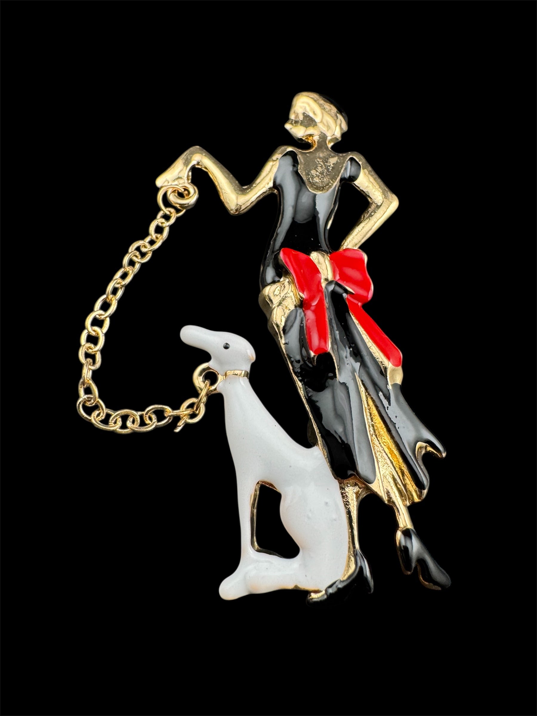 art deco lady with a dog on a lead brooch